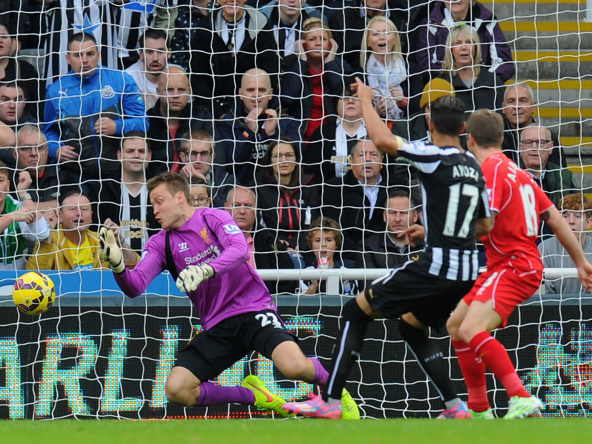 Ayoze Perez scores for Newcastle against Liverpool