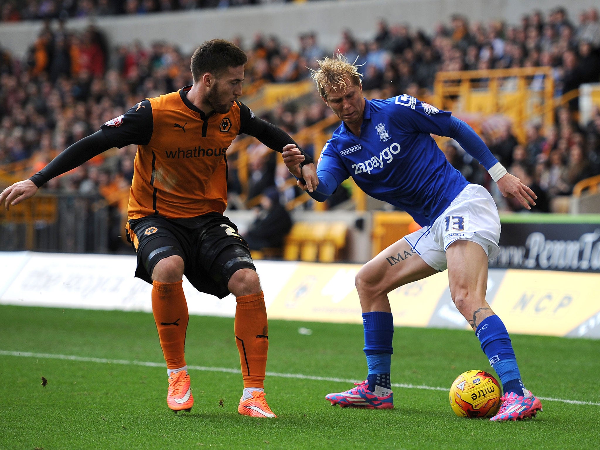 Wolverhampton Wanderers' Matt Doherty (left) and Birmingham City's Brek Shea battle for the ball