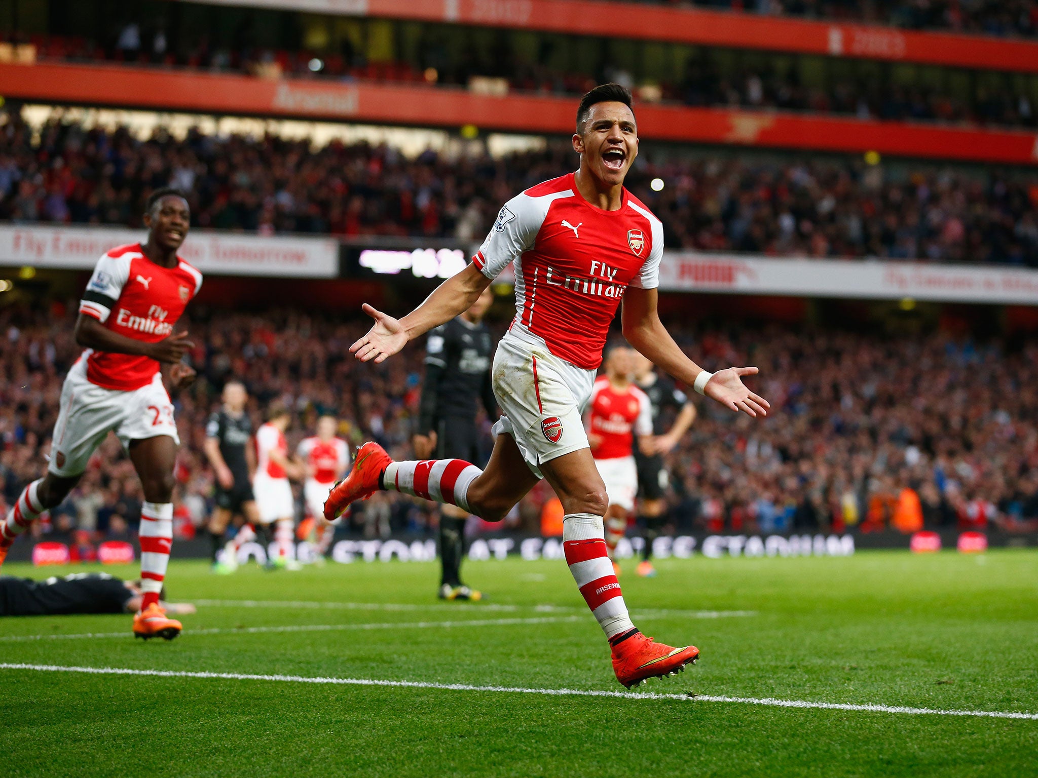 Alexis Sanchez celebrates scoring the opening goal for Arsenal against Burnley