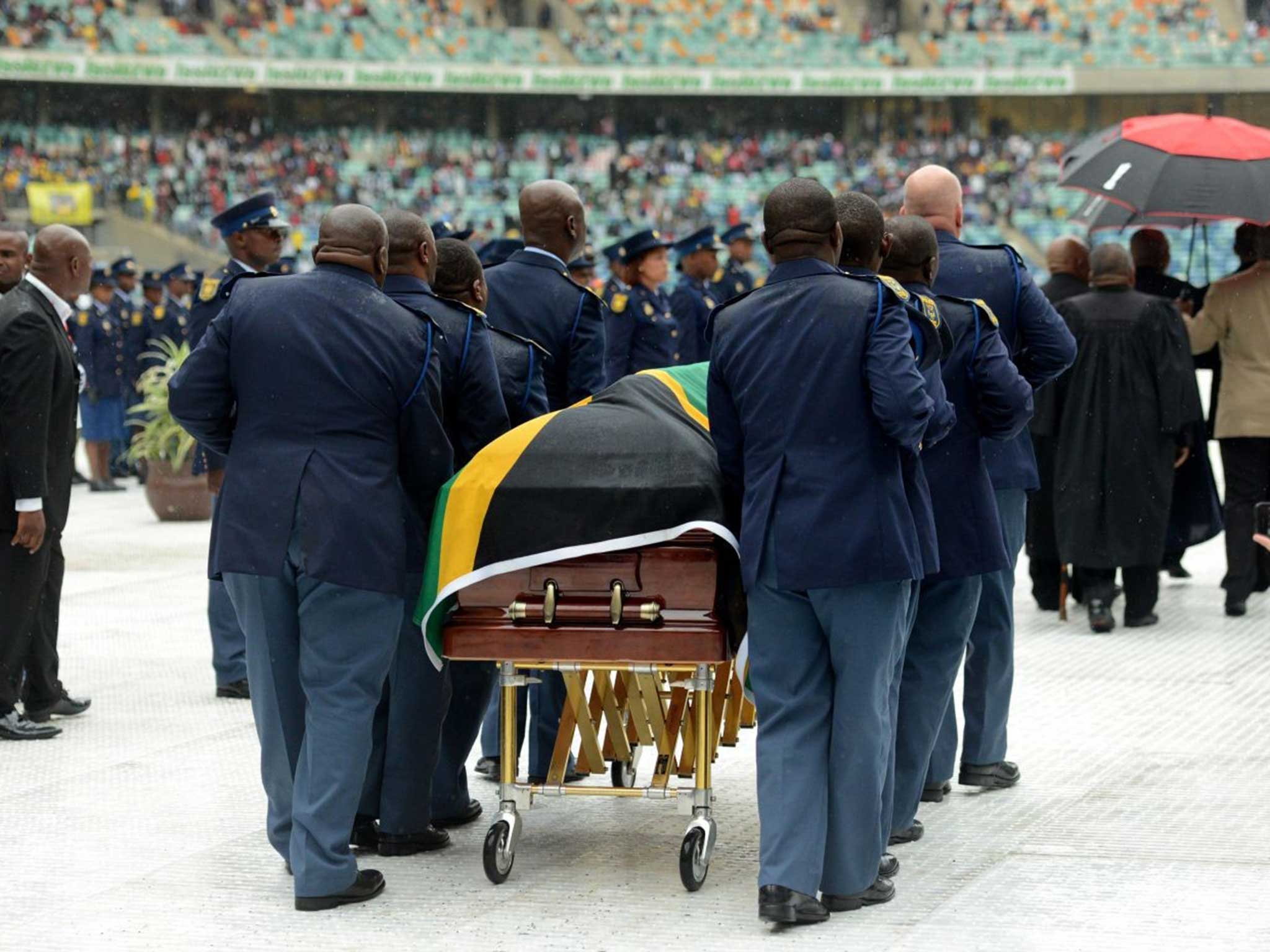 Meyiwa's teammates flank the coffin