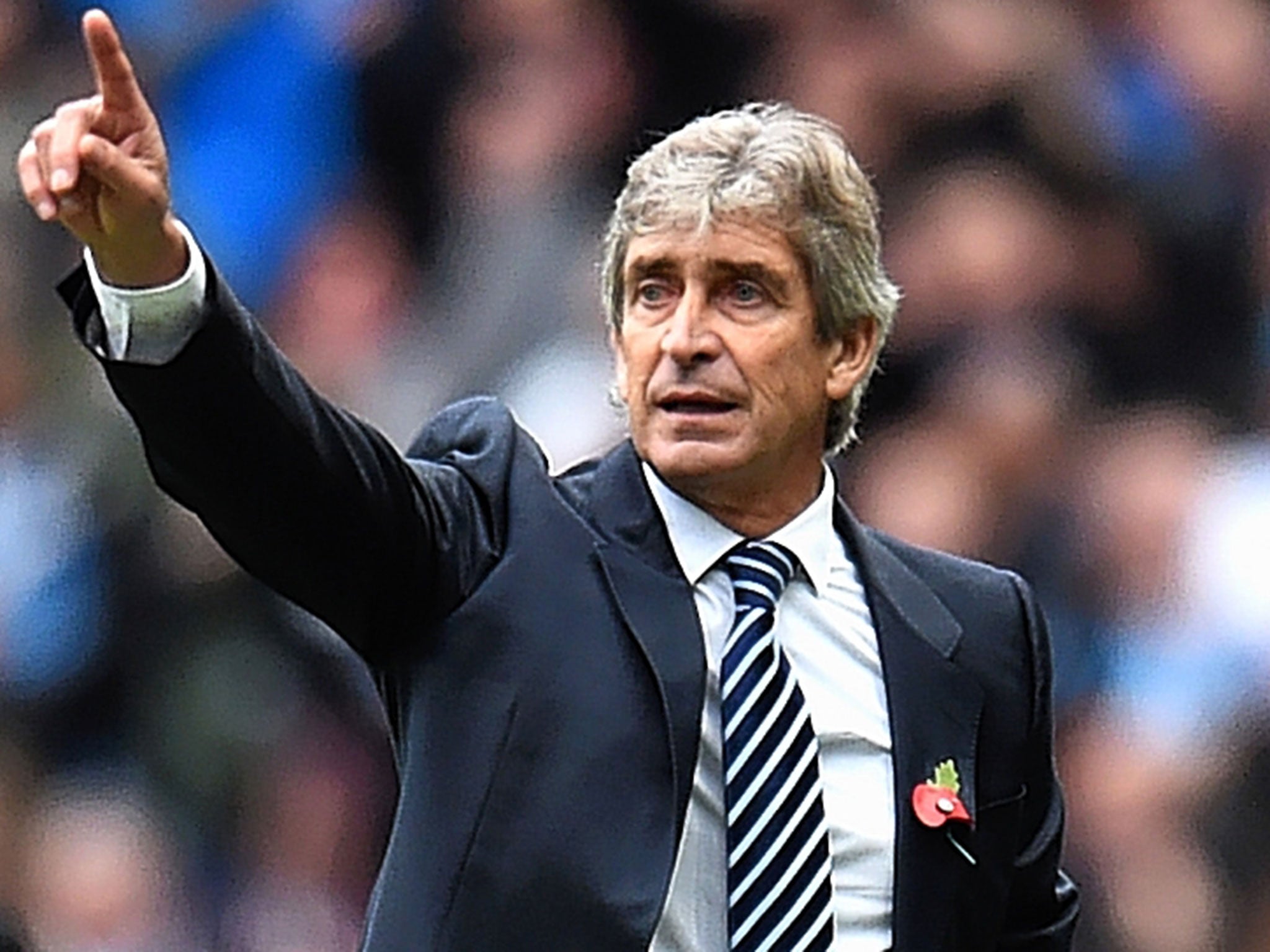 Manuel Pellegrini makes a point on the touchline