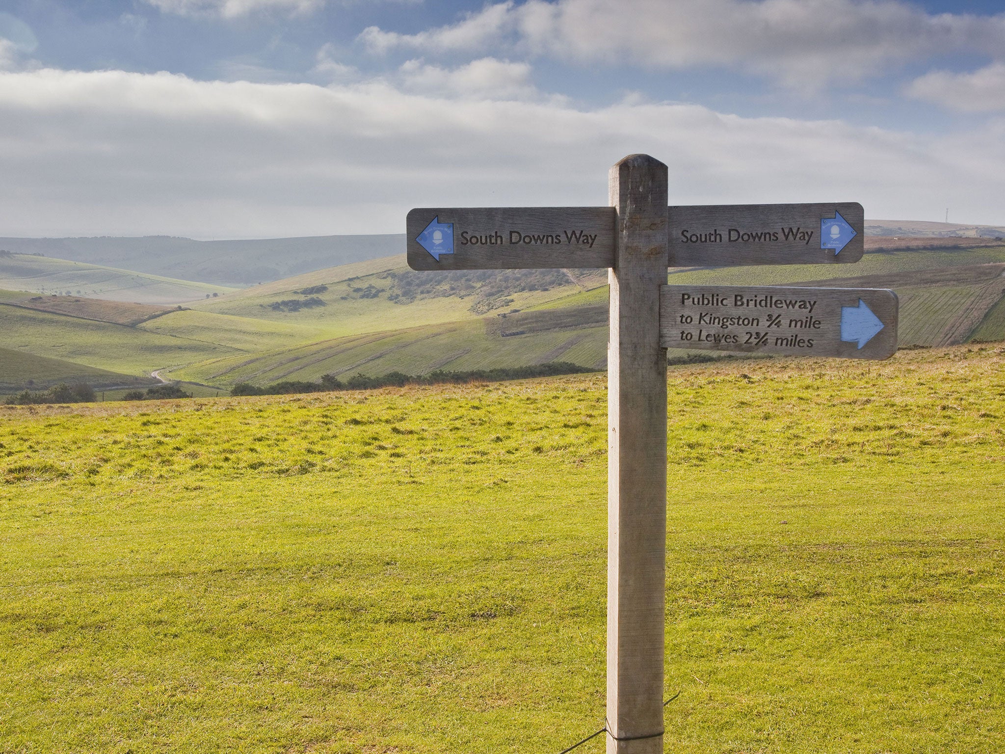 The rolling hills of the South Downs National Park near to Brighton, Sussex. Residents of the South Downs National Park have accused the Government of attempting to drive through road development proposals in sensitive areas along the South Coast without