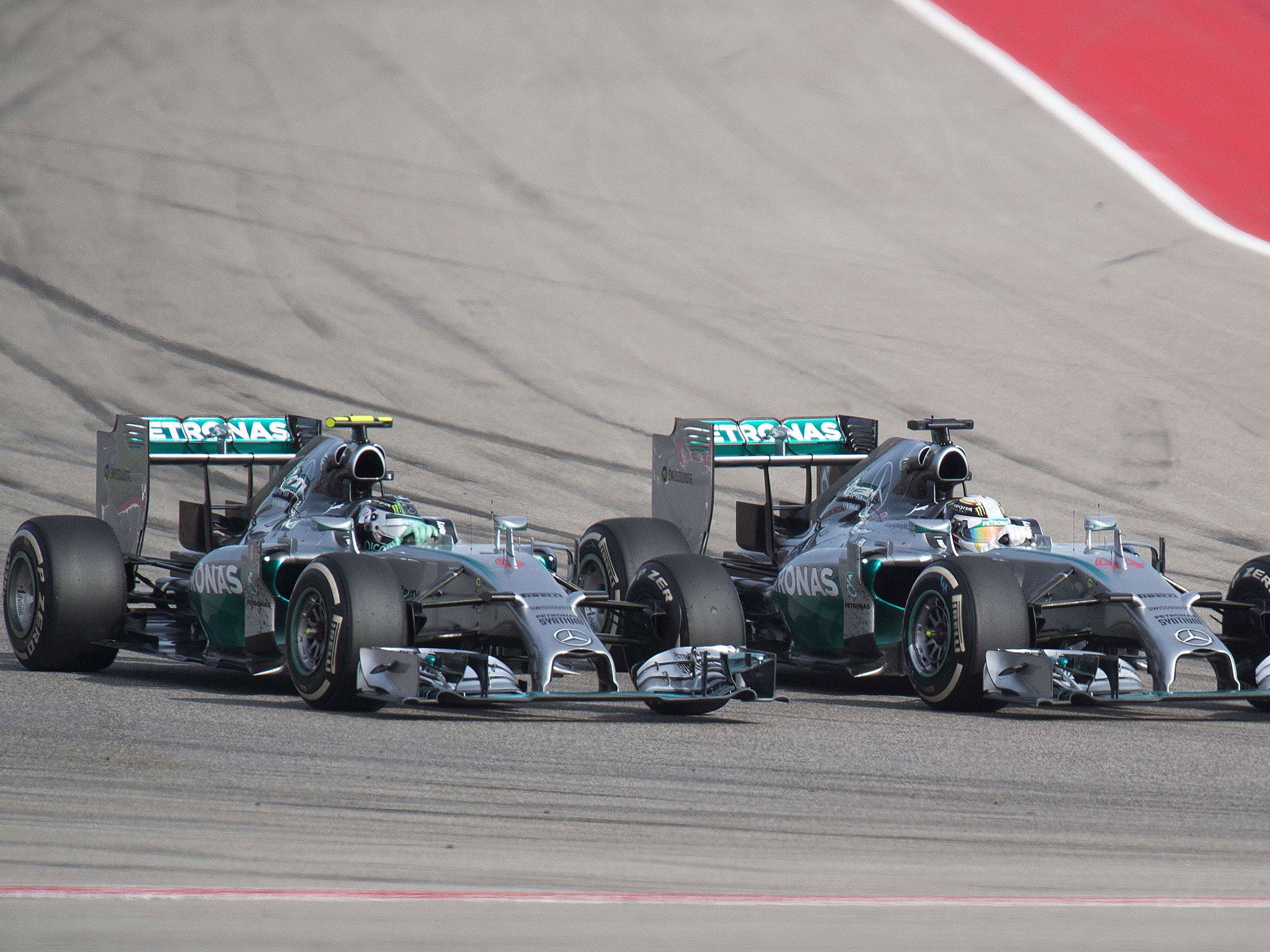 Hamilton (right) overtakes Mercedes team-mate Nico Rosberg in Austin