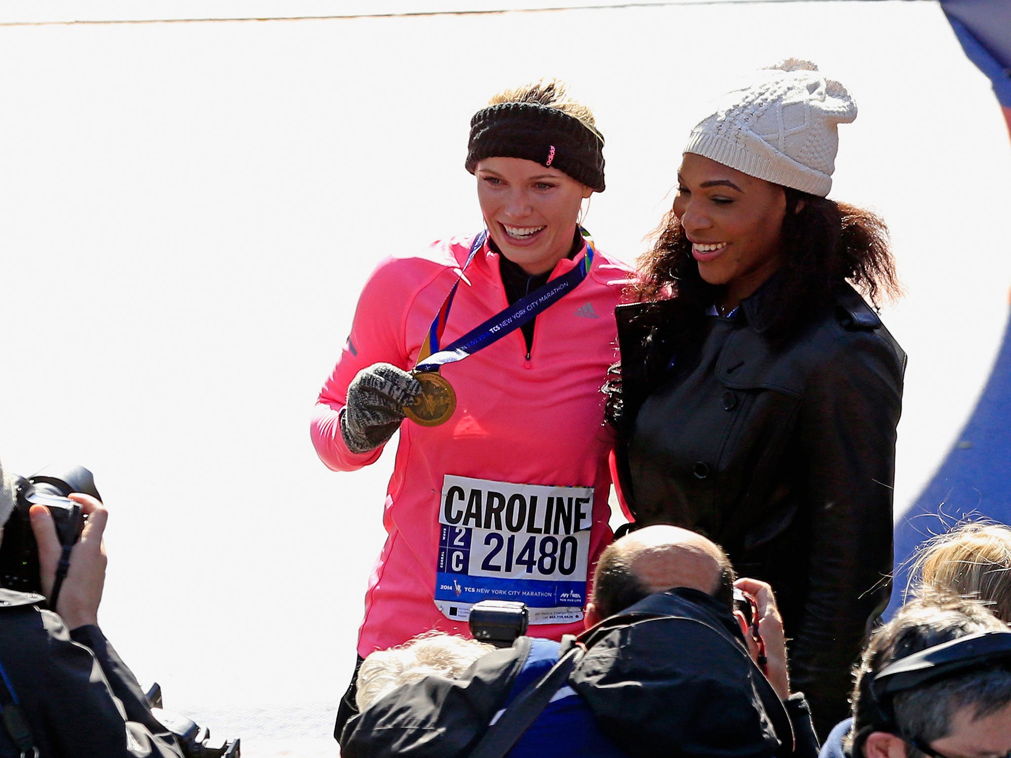 Caroline Wozniacki with Serena Williams after the marathon