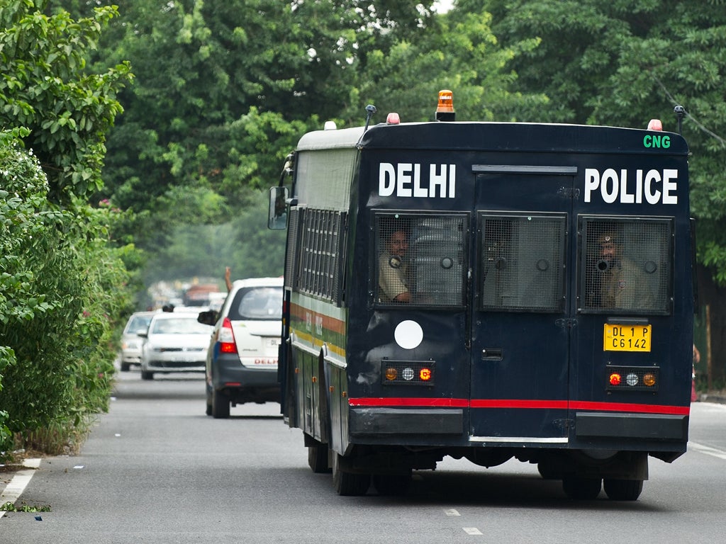 A Indian police vehicle believed to be carrying the accused in a gangrape and murder case, leaves the Saket District Court following the verdict in New Delhi on September 10, 2013. An Indian court convicted the four men of the gang rape and murder of a physiotherapy student on board a moving bus in a crime that sickened the nation