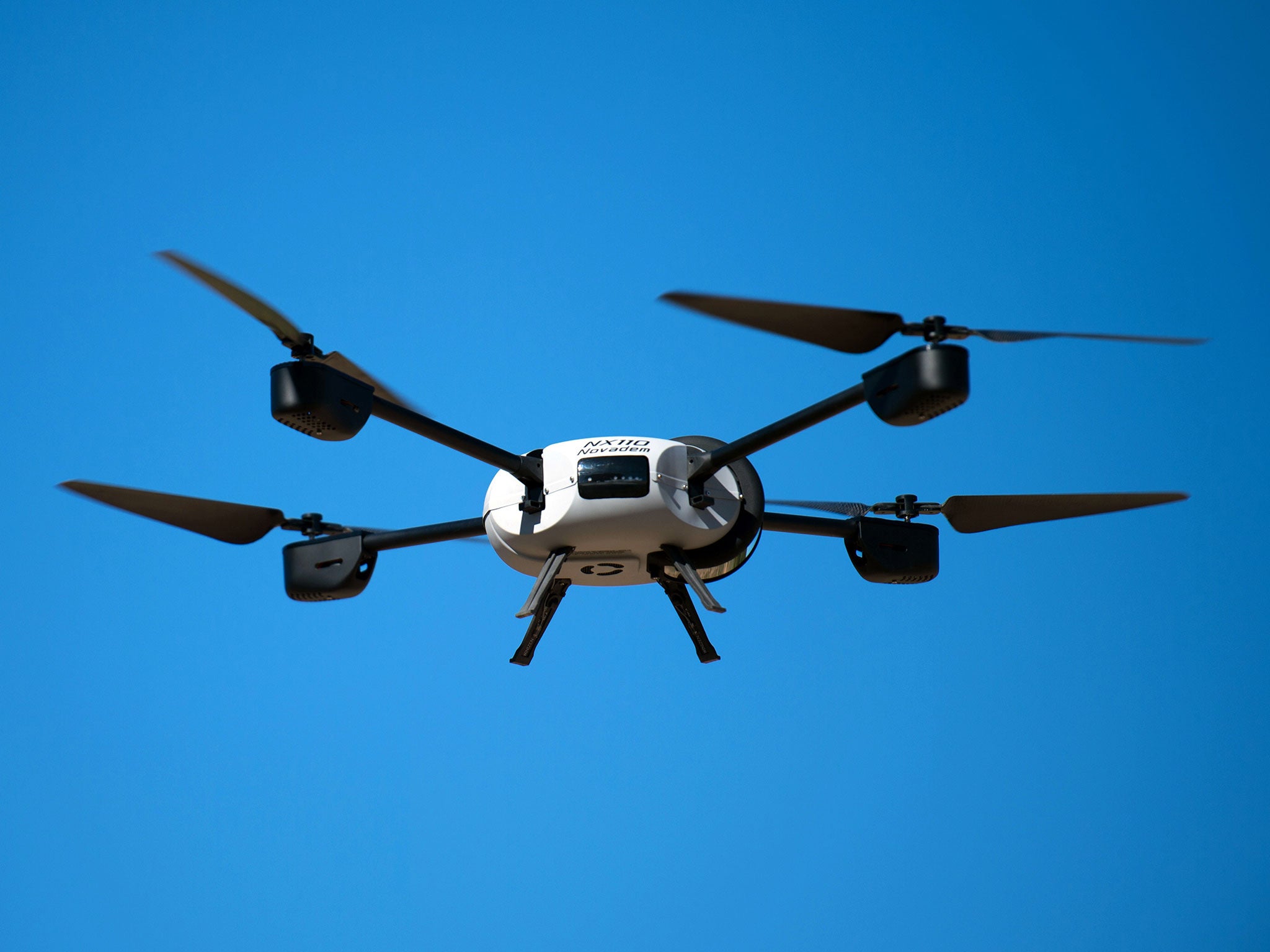 A Novadem NX 110 drone flies during a presentaion at a firefighter rescue centre in Les Pennes-Mirabeau, southern France, on August 28, 2014.