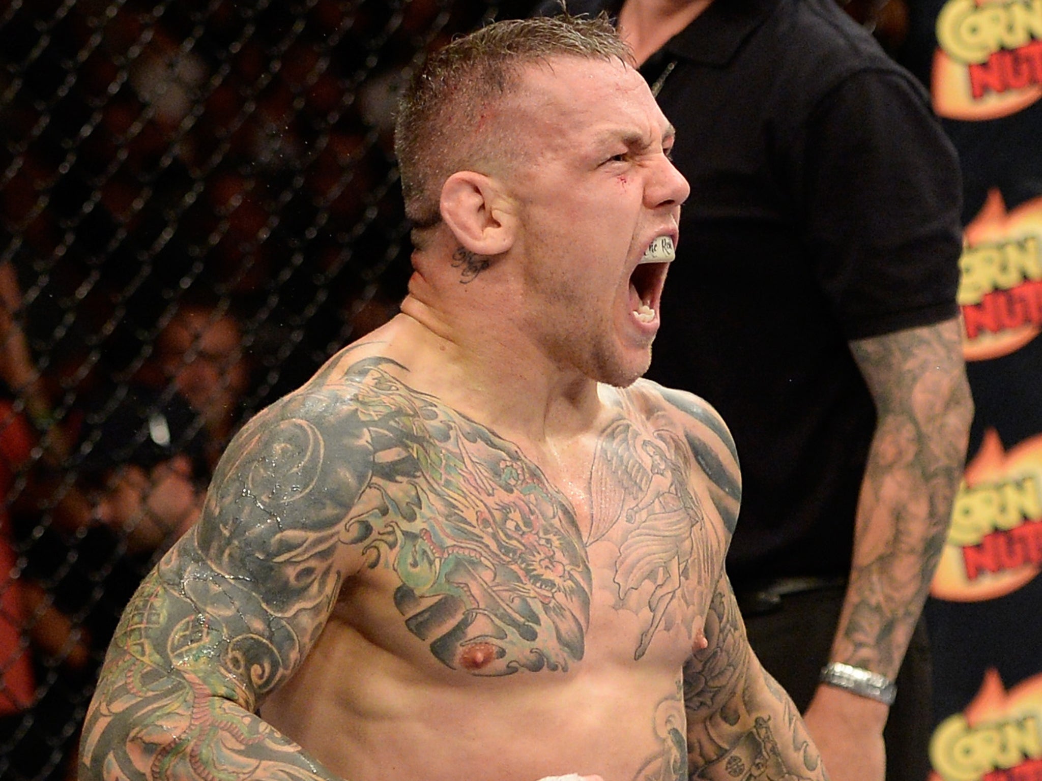 Ross Pearson celebrates after knocking out Gray Maynard