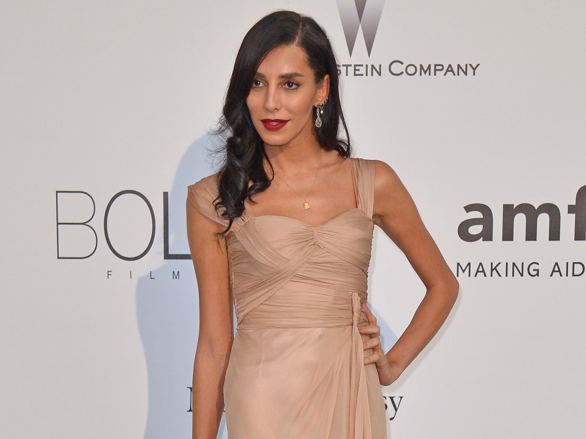 Brazilian model Lea Tisci (Lea T) poses as she arrives for the amfAR 21st Annual Cinema Against Aids during the 67th Cannes Film Festival