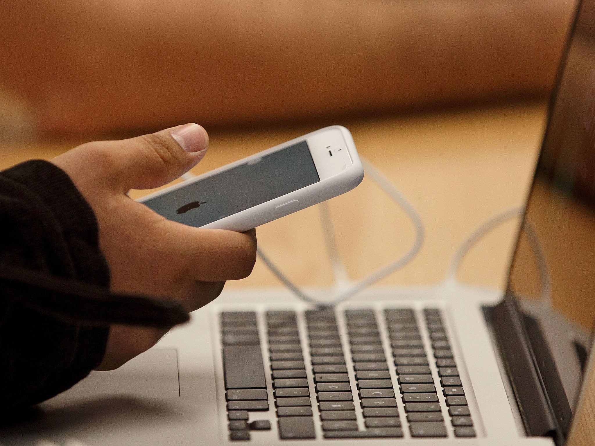 A customer holds his new iPhone