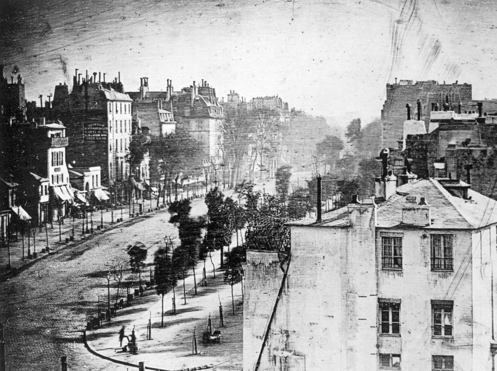 Daguerre's image of Boulevard du Temple, Paris, 3rd arrondissement, in 1838. The man having his shoes shined can be seen in the bottom left