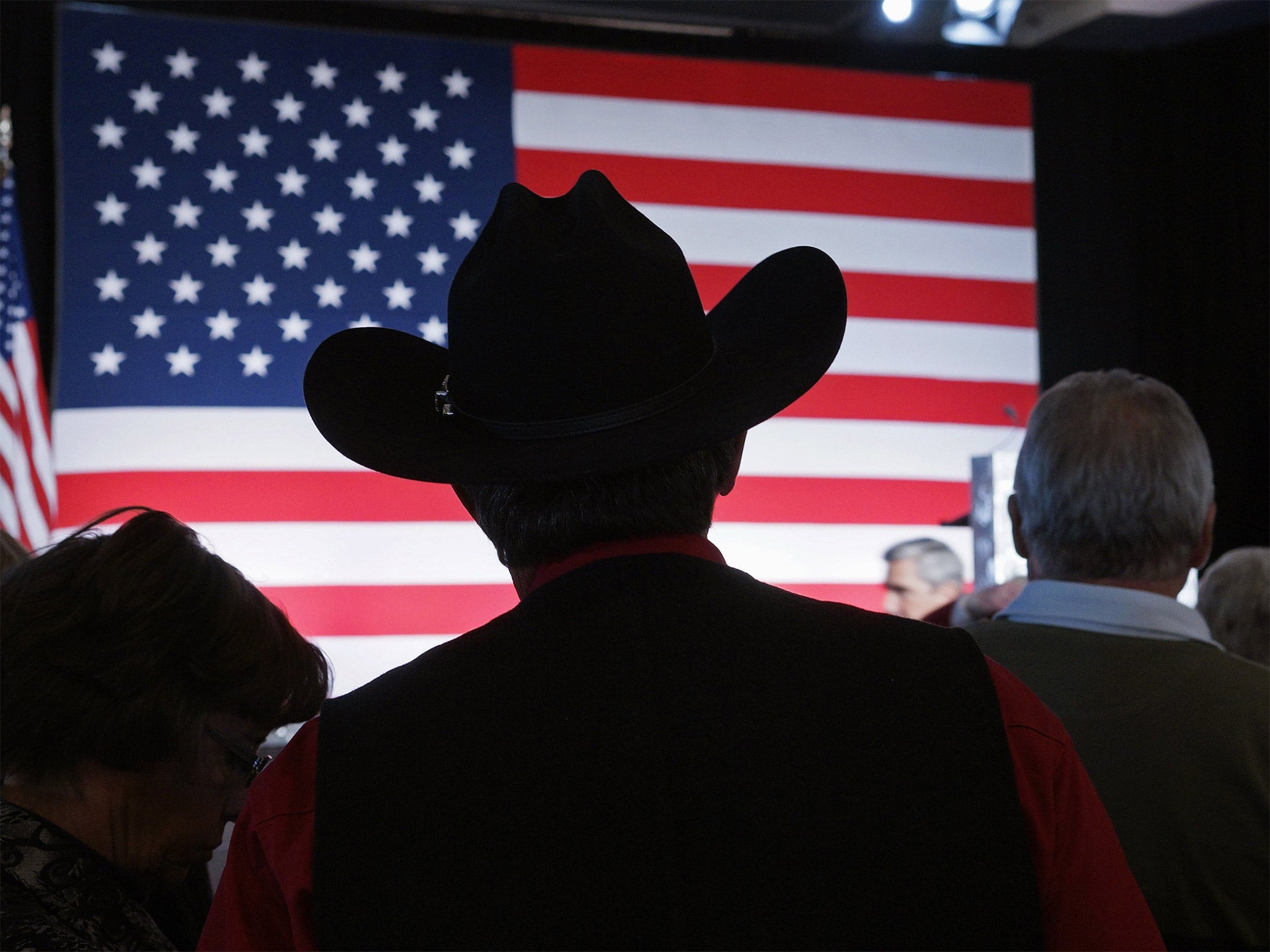 A Republican supporter watches the results in Denver, Colorado