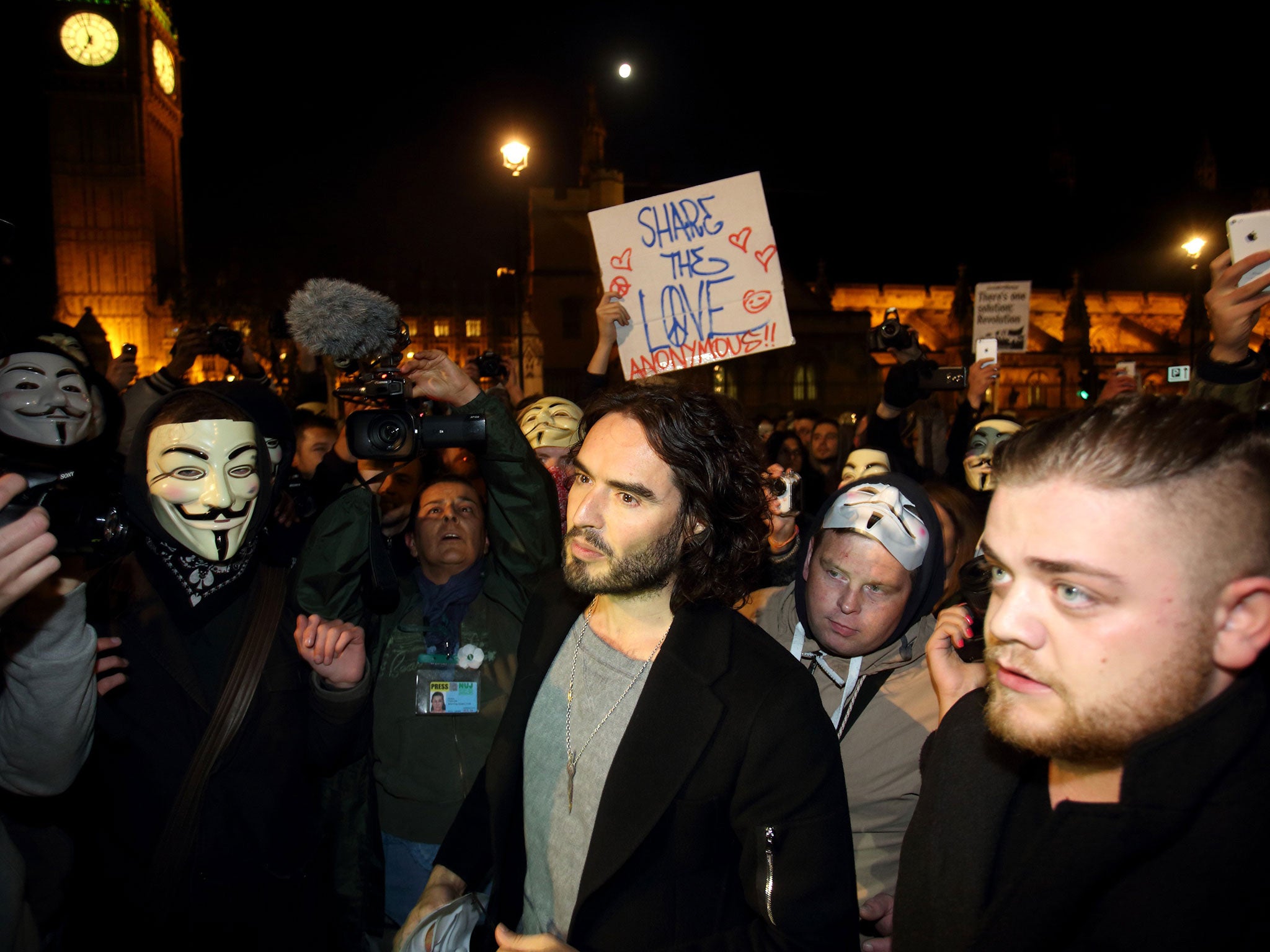 Russell Brand joins the protesters in Parliament Square during the Million Mask March on 5 November 2014 in London