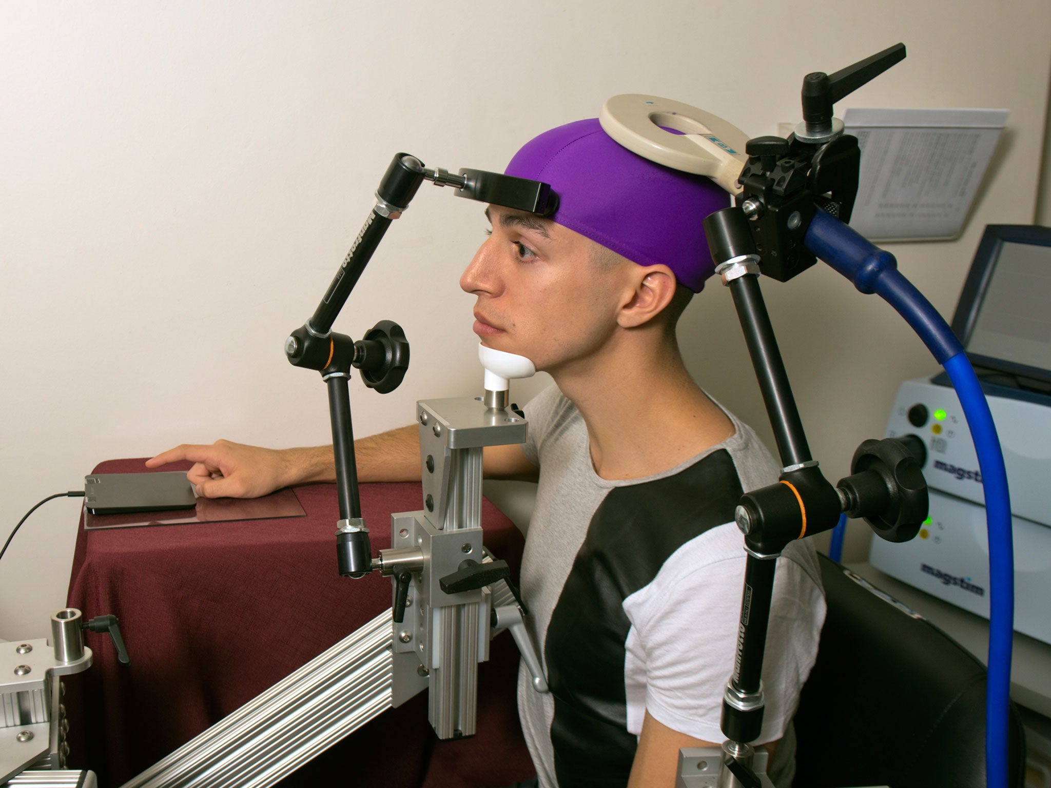 Student and guinea pig Jose Ceballos is ready to receive the signal from across campus. Mary Levin, University of Washington.