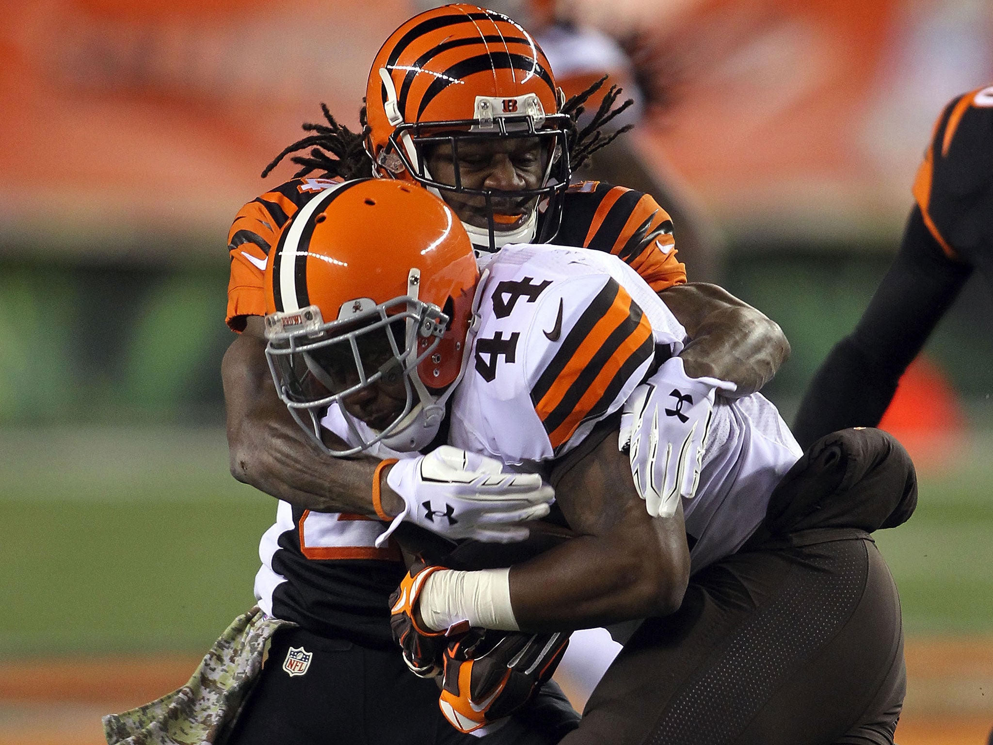 Adam Jones #24 of the Cincinnati Bengals tackles Ben Tate #44 of the Cleveland Browns