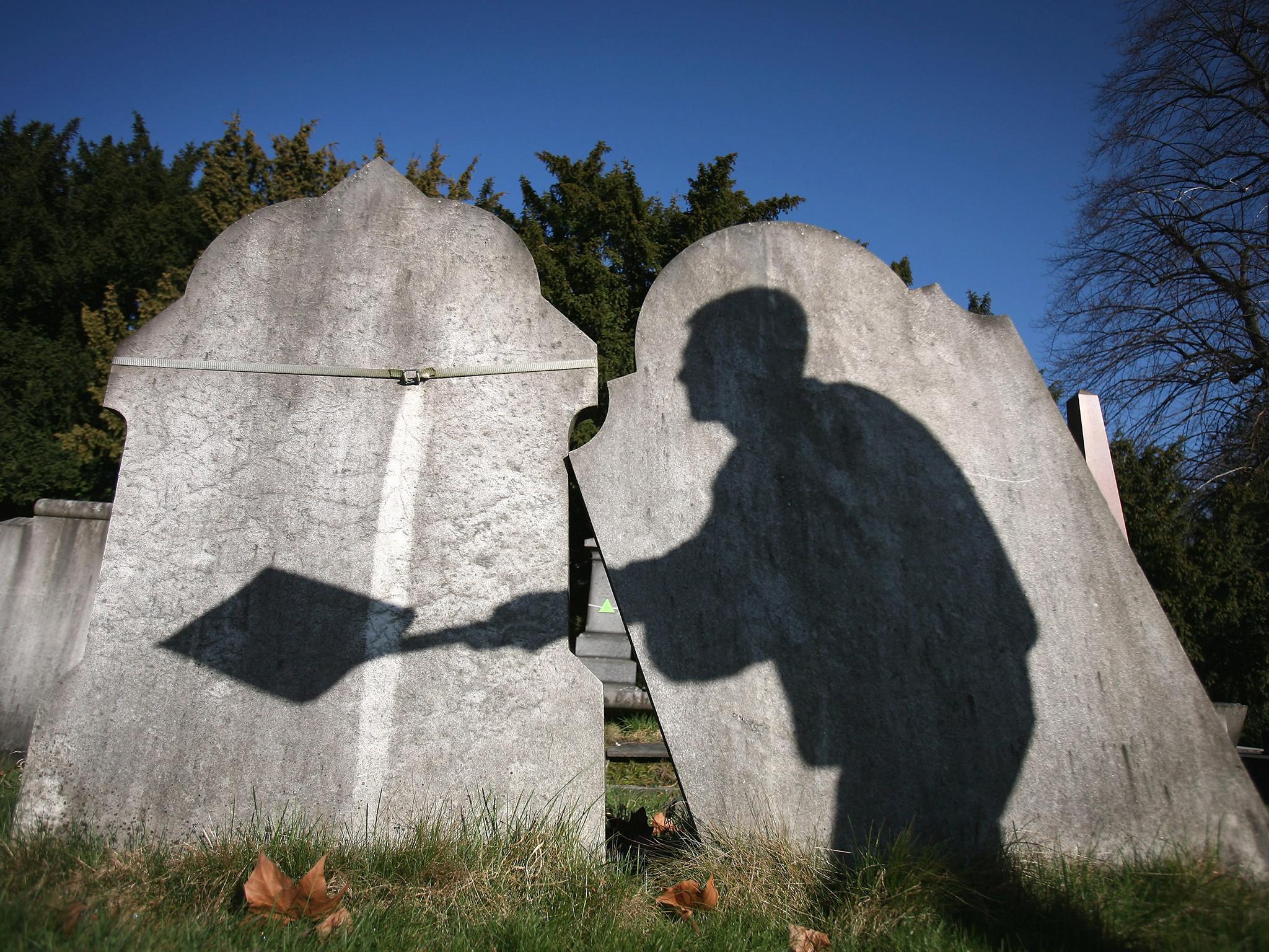 The practice involves placing a new body in an existing grave (Dan Kitwood/Getty Images)