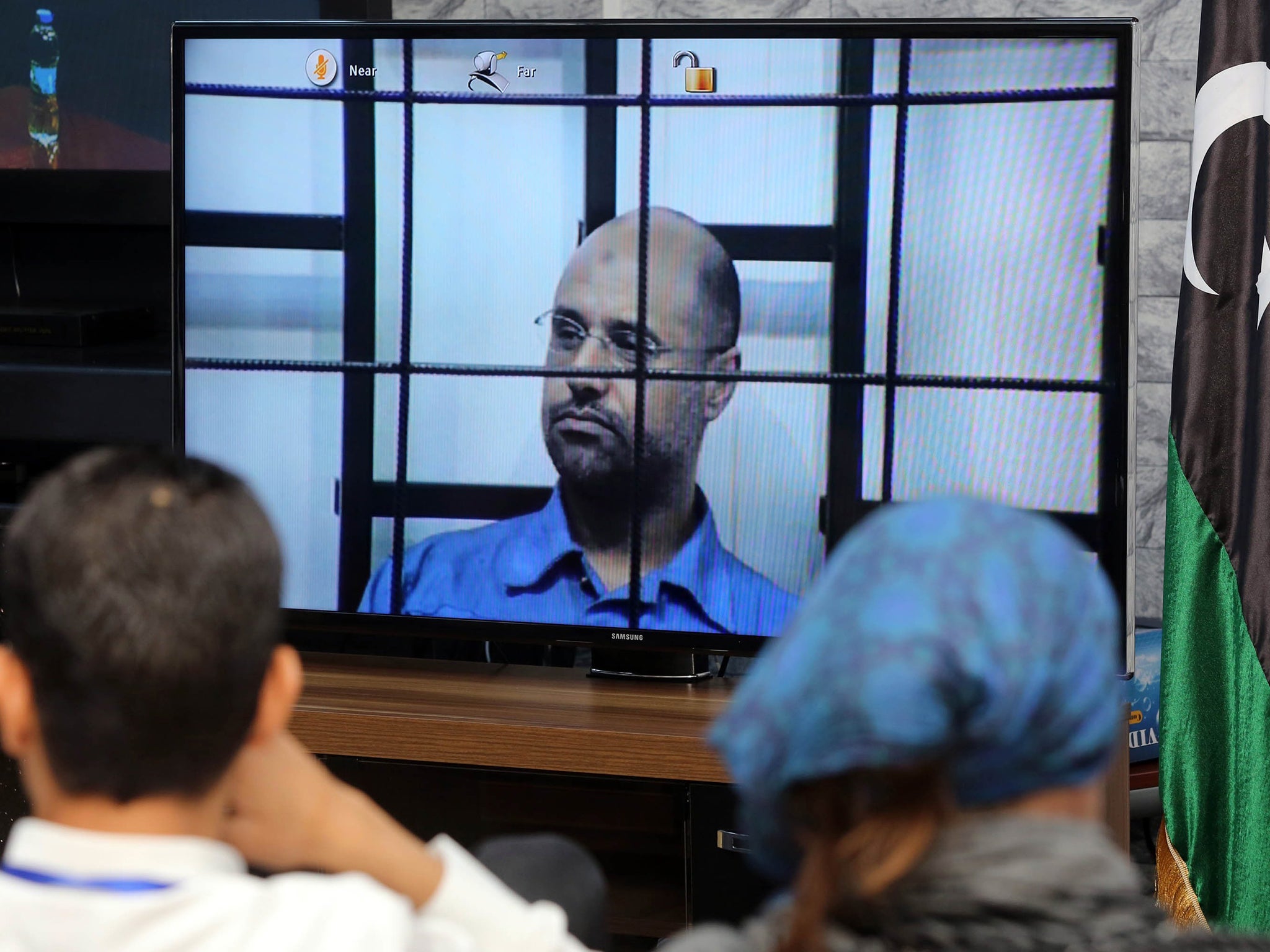 The detained Saif al-Islam Gaddafi gives evidence on court television in Libya earlier
this year