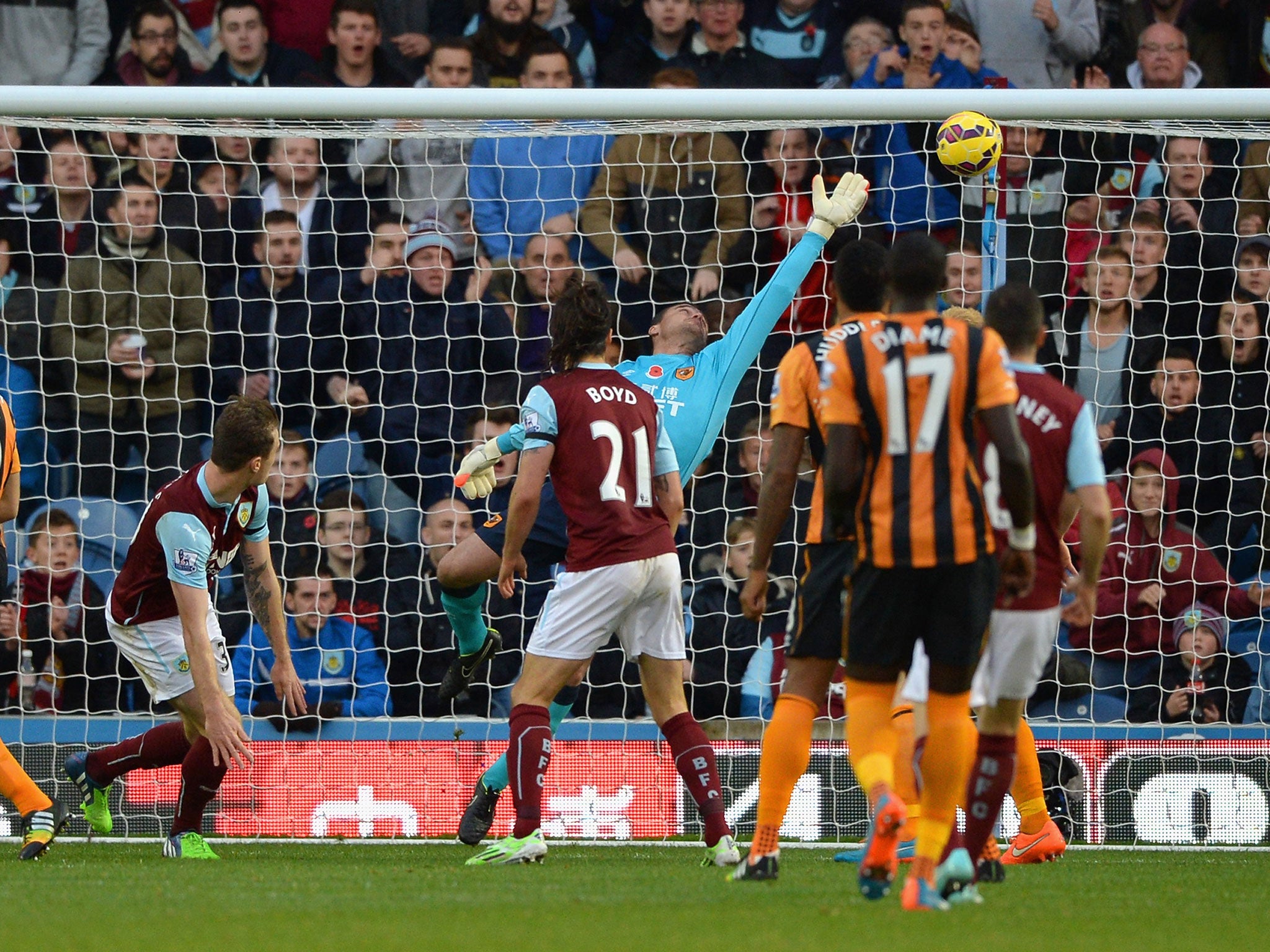 Ashley Barnes heads the ball past Steve Harper