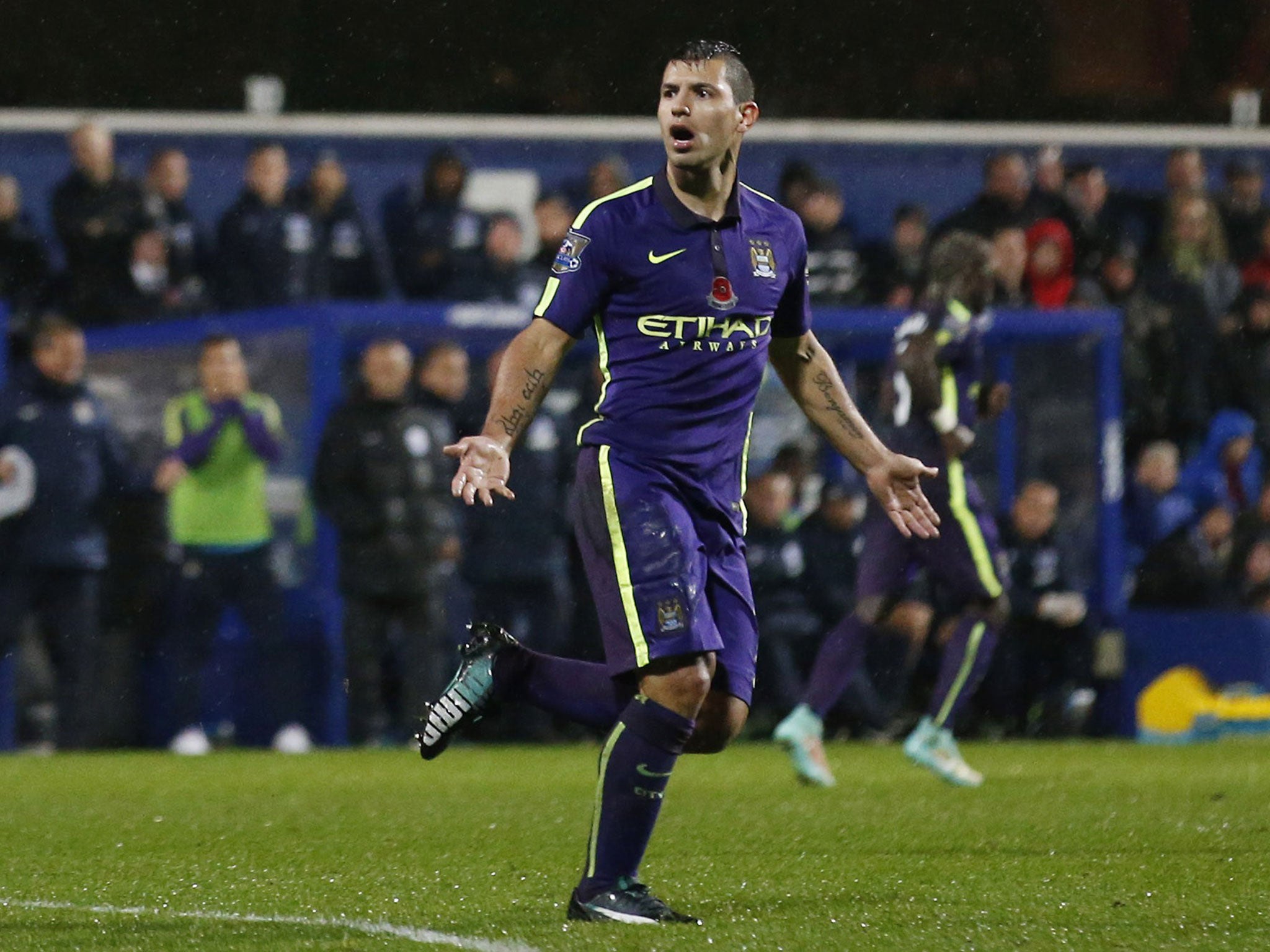 Sergio Aguero celebrates after scoring against QPR