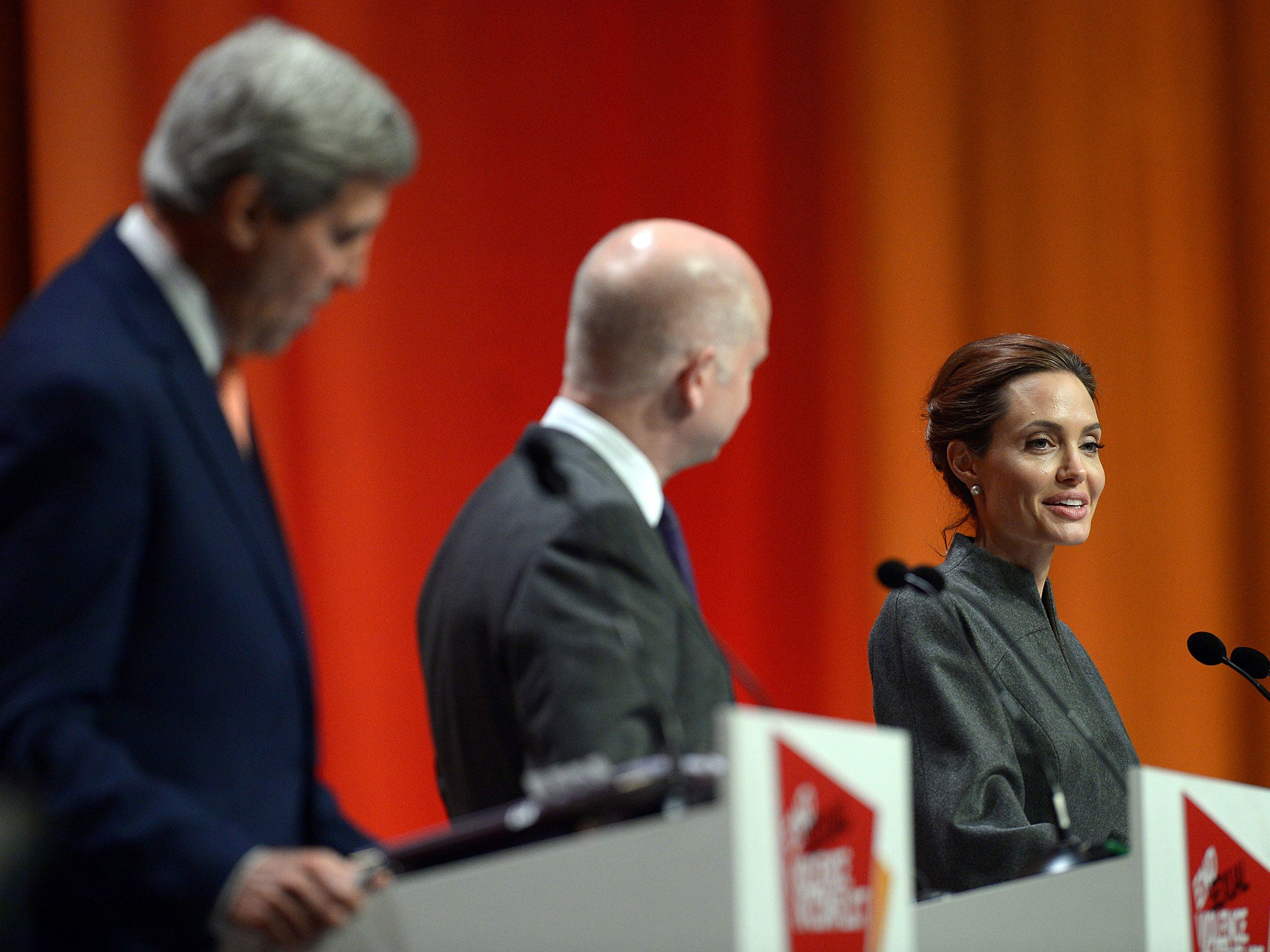 Angelina Jolie, with William Hague and John Kerry, should not confuse her role as UN envoy with internal US politics