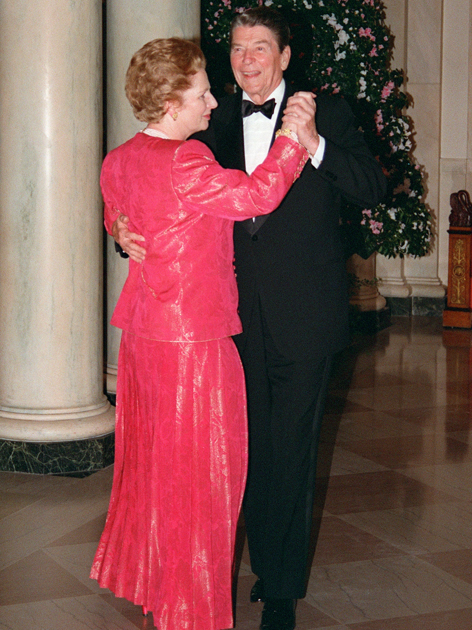 Margaret Thatcher dances with US President Ronald Reagan 16 November 1988 following a state dinner given in her honor at the White House.