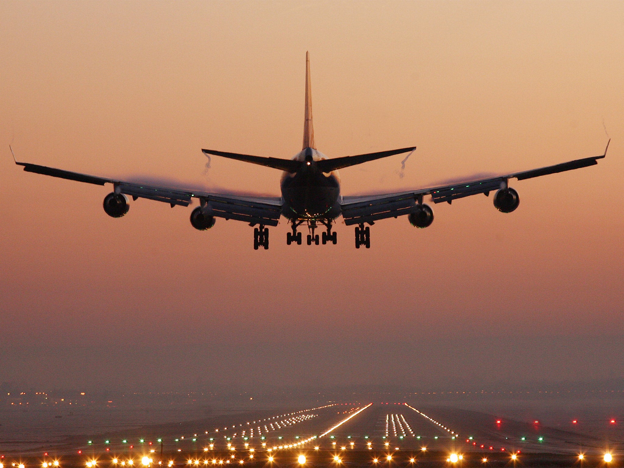 An passenger jet preparing to land at Gatwick Airport in West Sussex