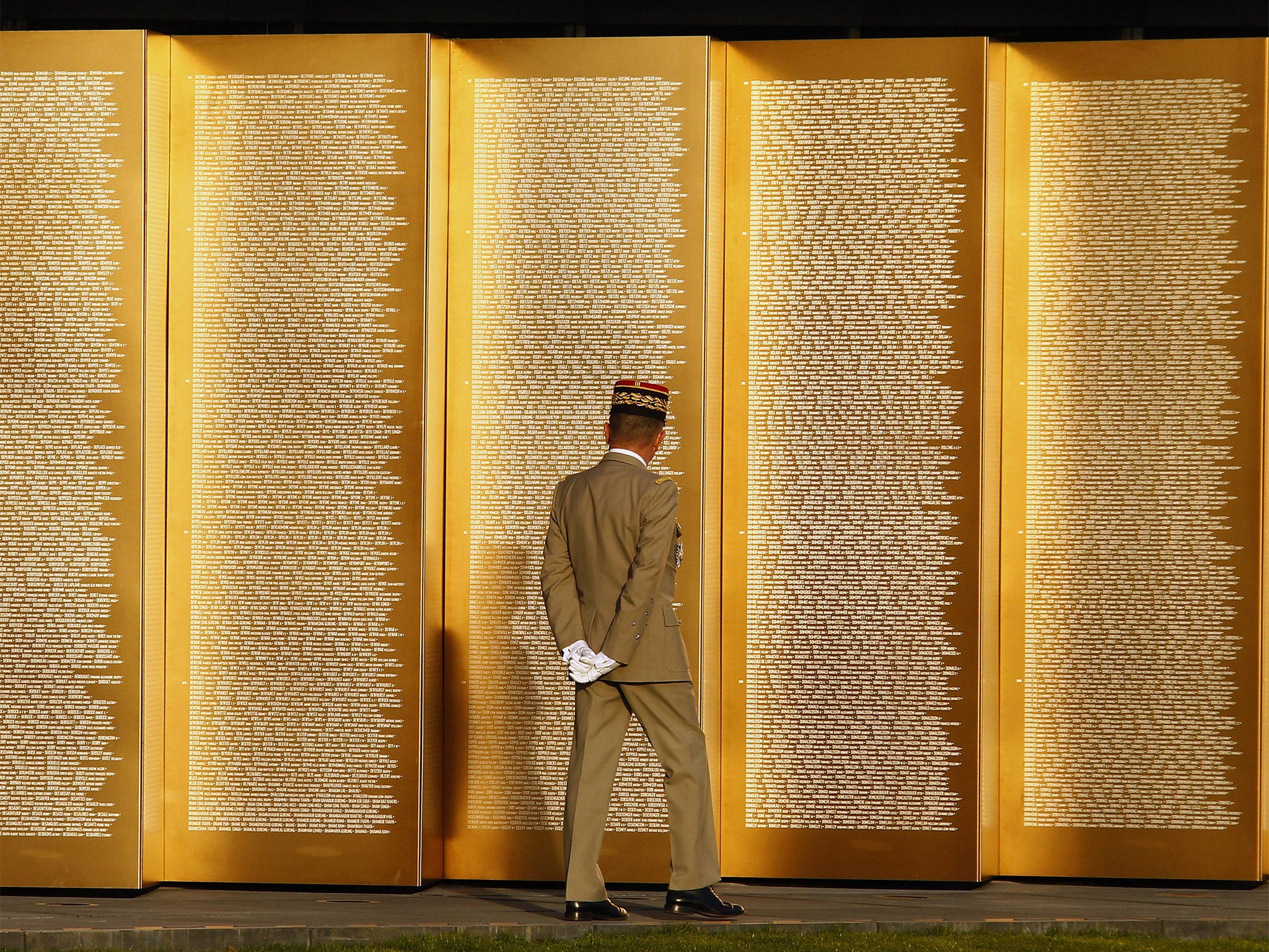 French chief of staff General Benoit Puga inspects the memorial at Notre Dame de Lorette