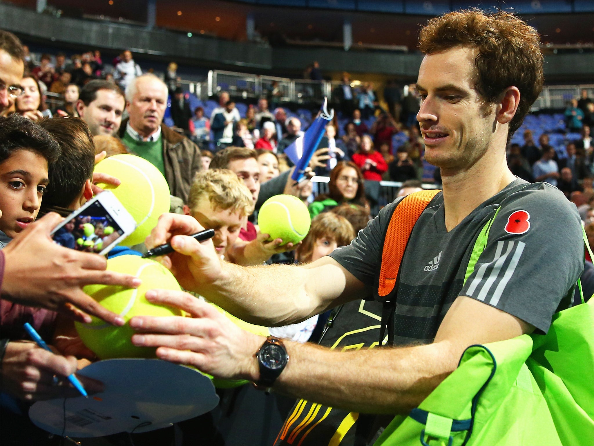 Andy Murray pictured signing autographs