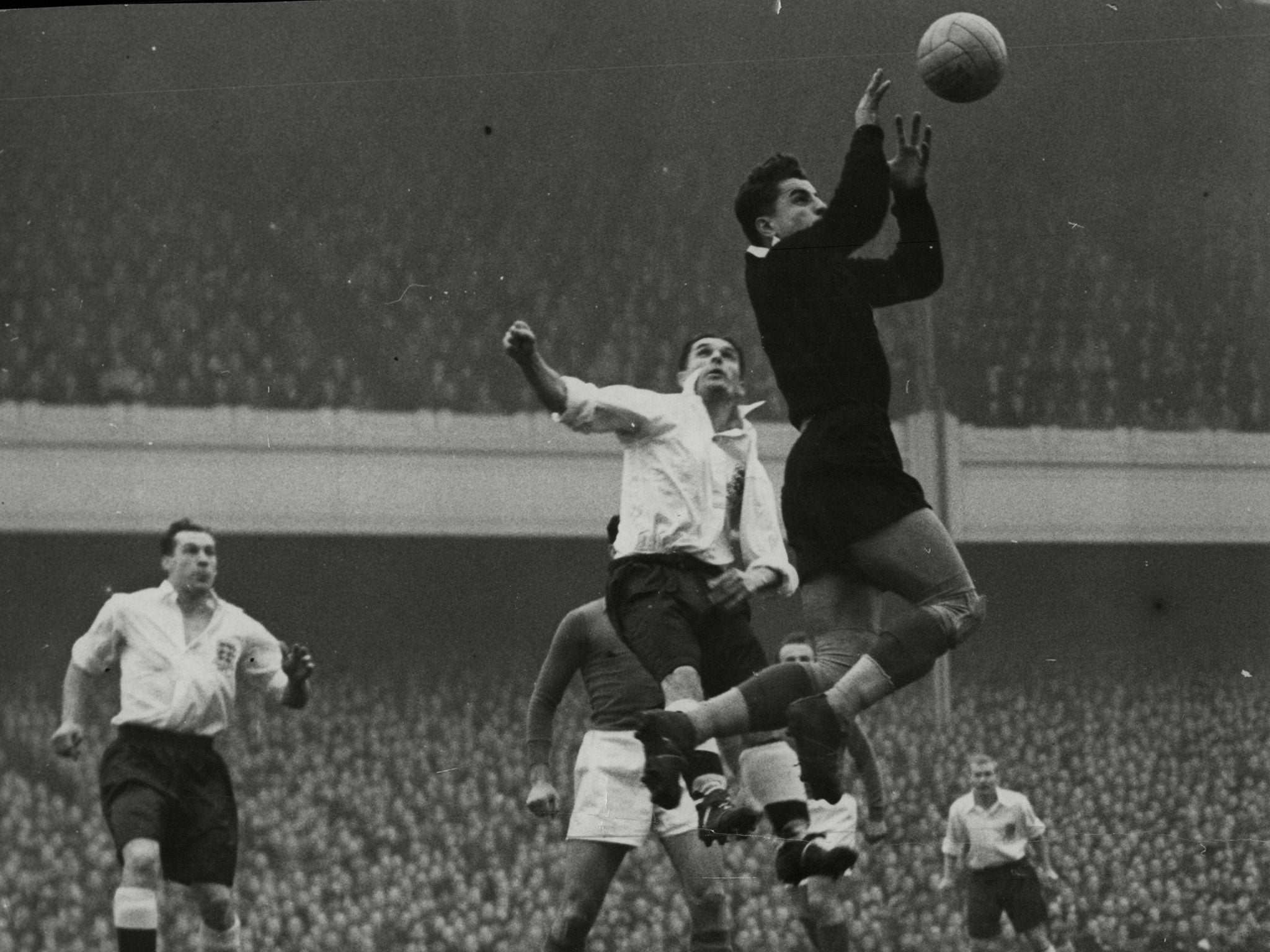 Vladimir Beara, the Yugoslavian goalkeeper saving from England's Nat Lofthouse