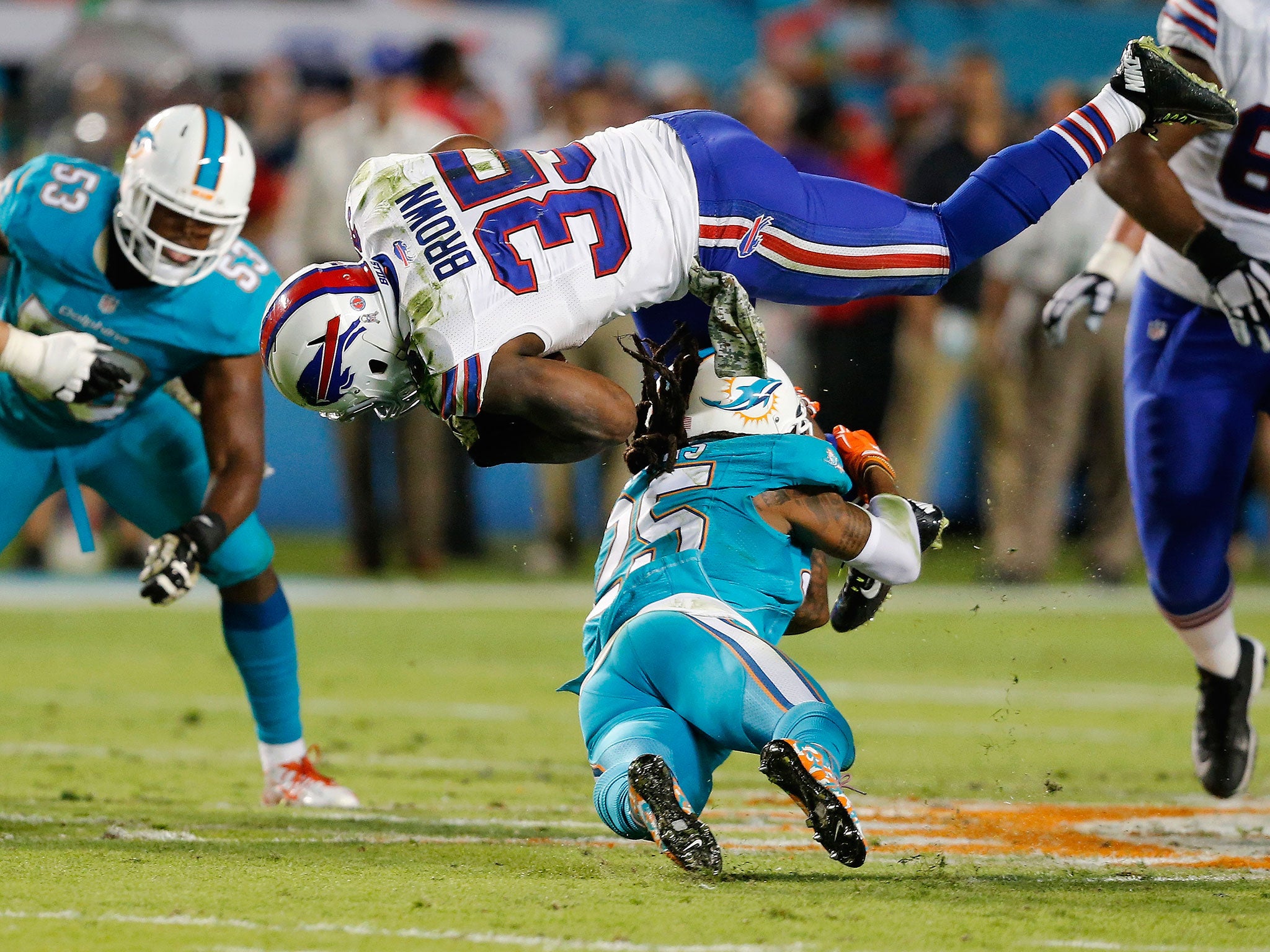 Bills' running-back Bryce Brown is tackled by Dolphins' safety Louis Delmas