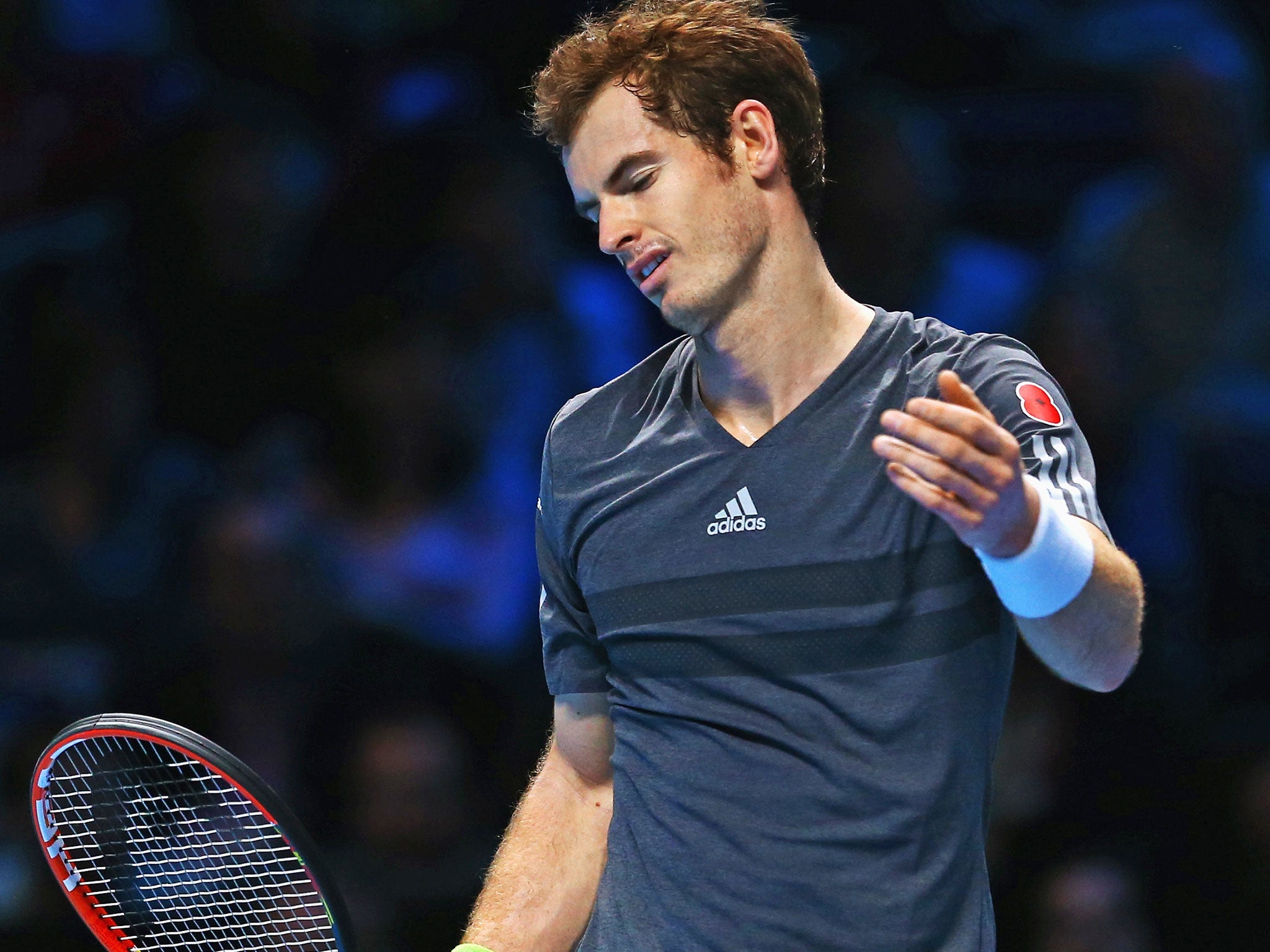 Andy Murray reacts during his defeat to Roger Federer at the O2 Arena on Thursday