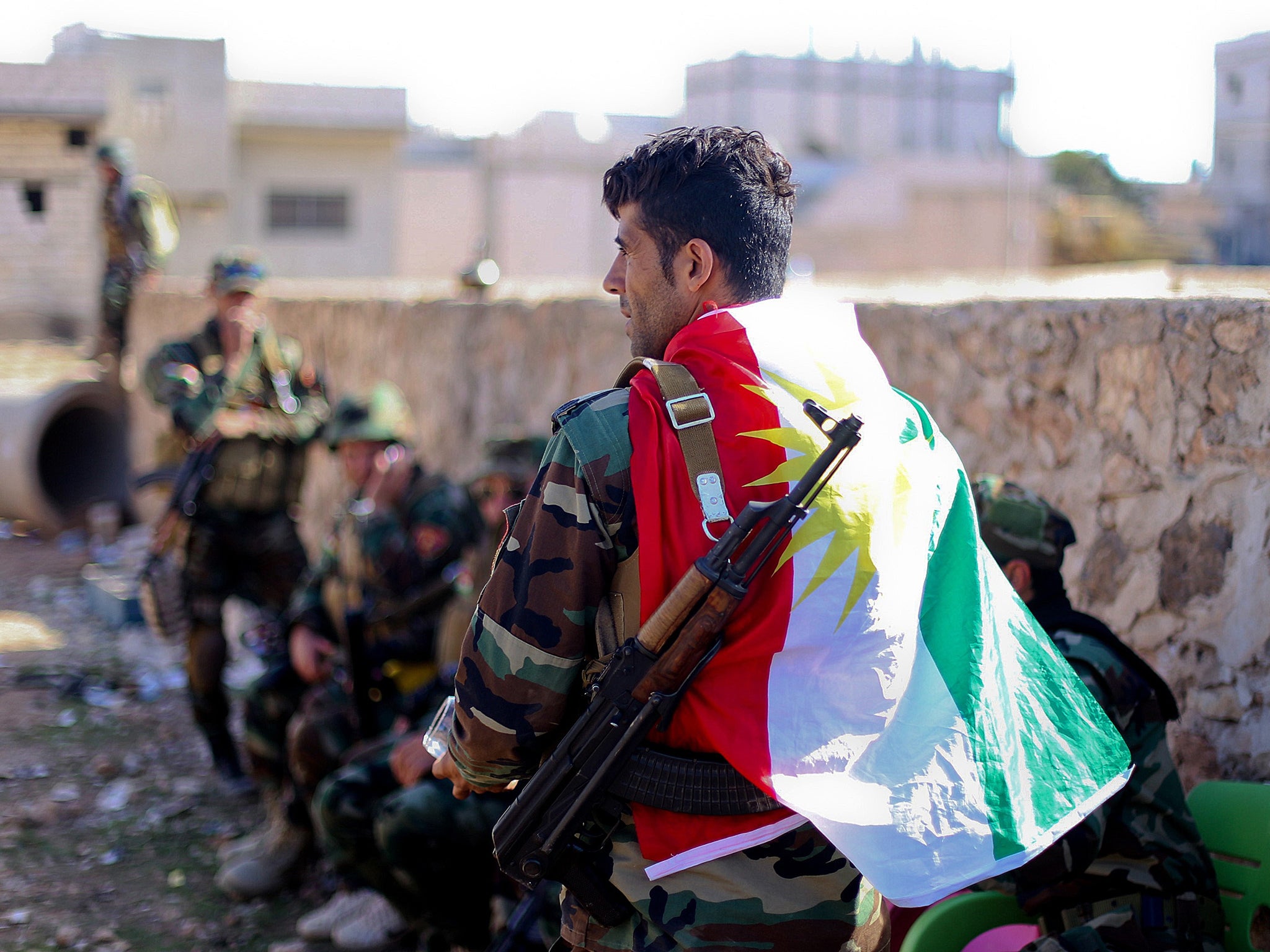 Armed Kurdish fighters who oppose Isis in Kobani last week; their heroic defence of the town has won them plaudits