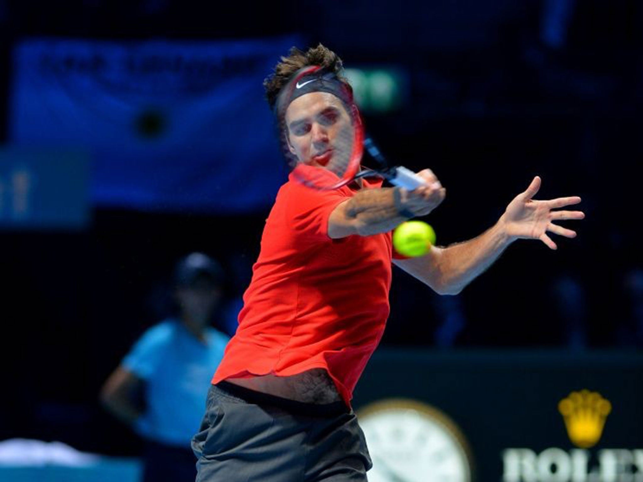 Rodger Federer returns to fellow Swiss Stanislas Wawrinka during their semi-final singles match