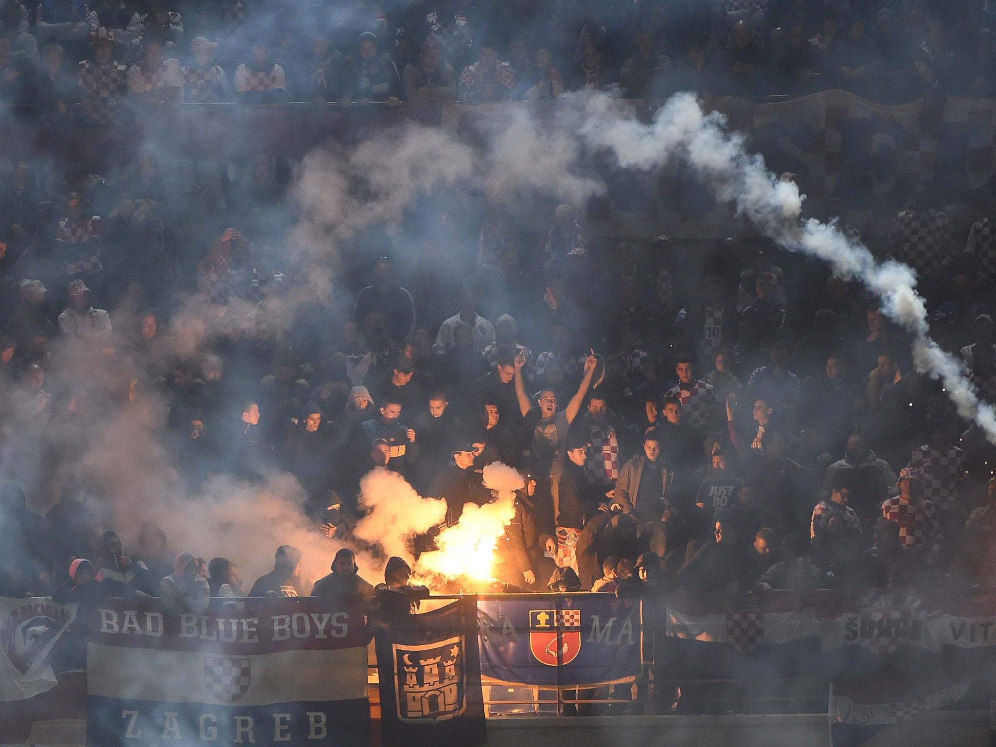 Croatia fans cause the match against Italy to be suspended after lighting flares