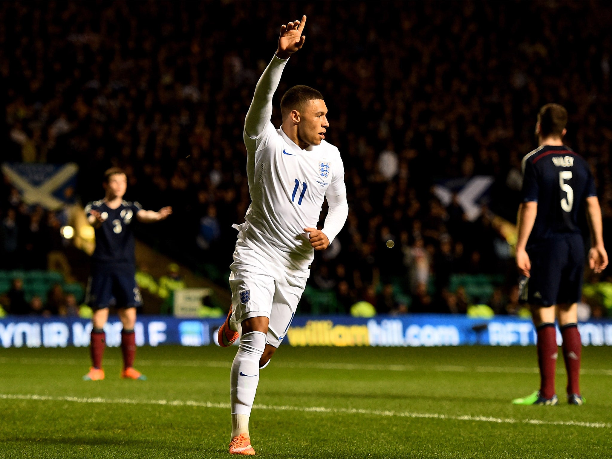 Oxlade-Chamberlain celebrates after heading England in front