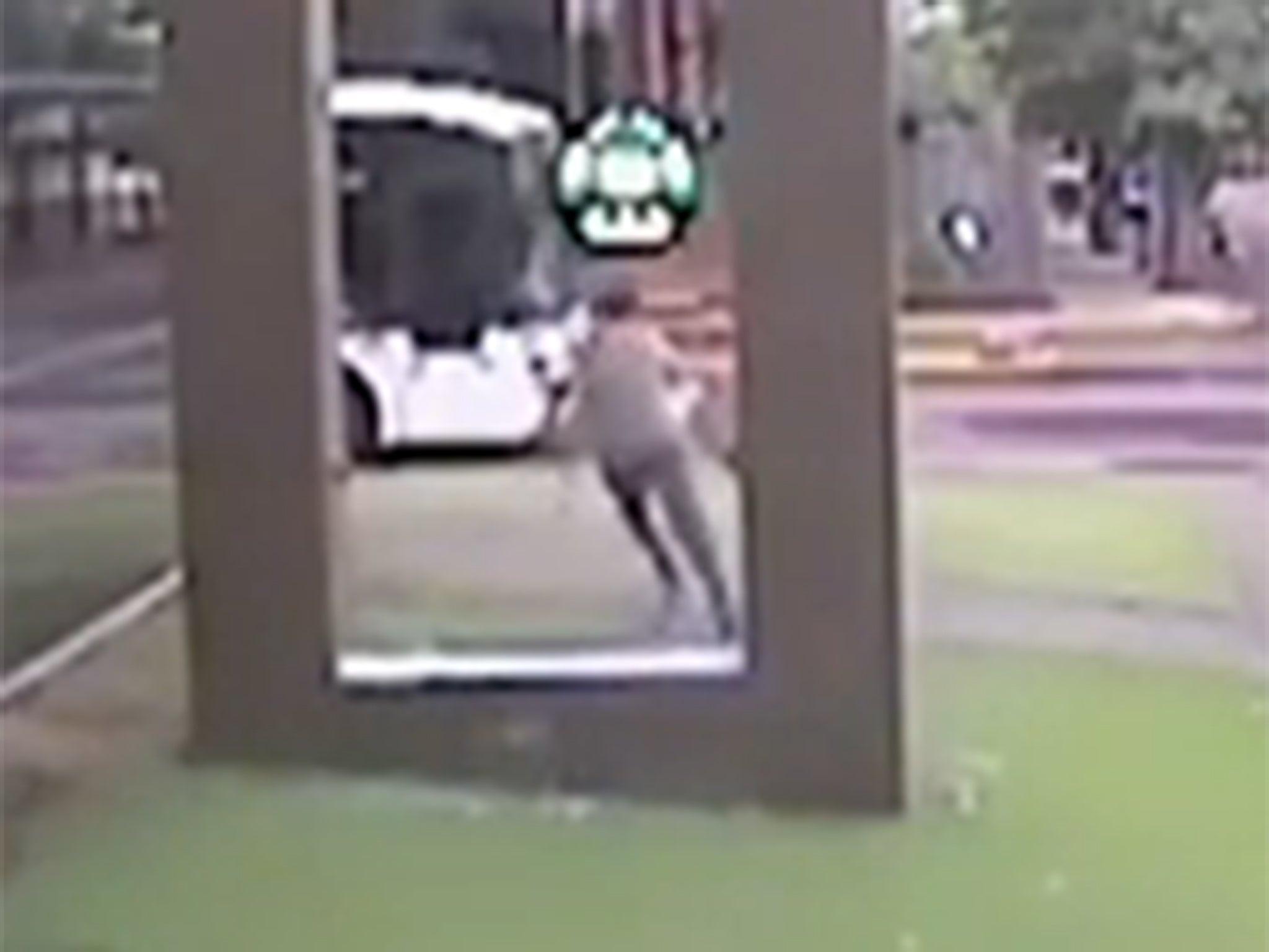 The “extra life” green mushroom appears above the man's head after he breaks the glass pane