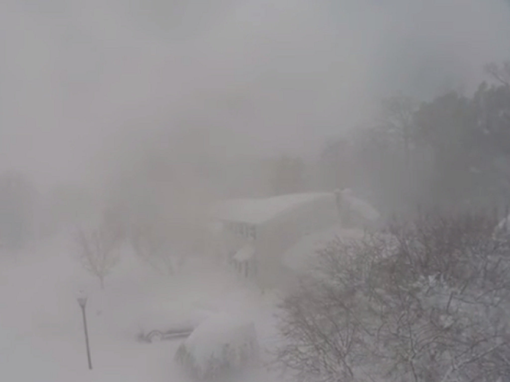 A shot of the empty snow-covered streets from the aerial drone camera