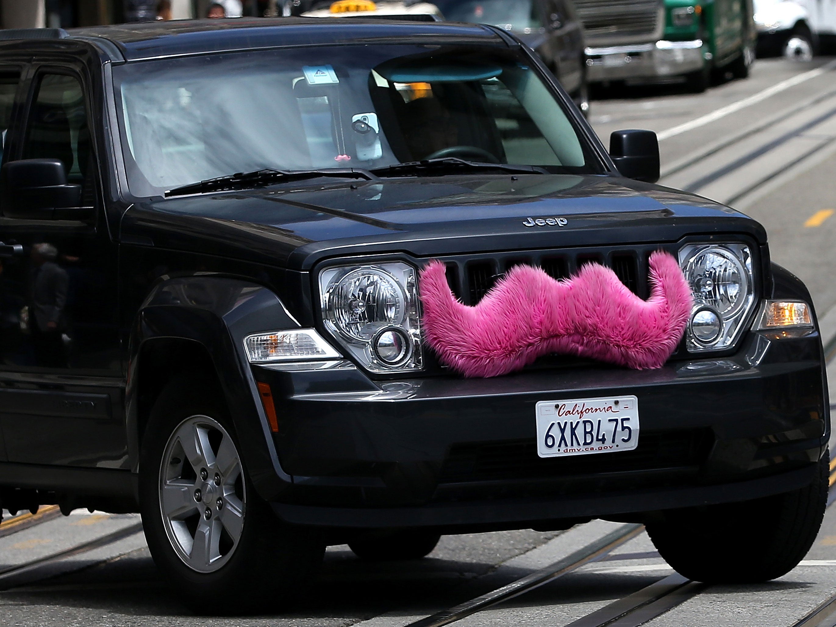 A Lyft car bearing the company's trademark moustache. Source: Getty Images