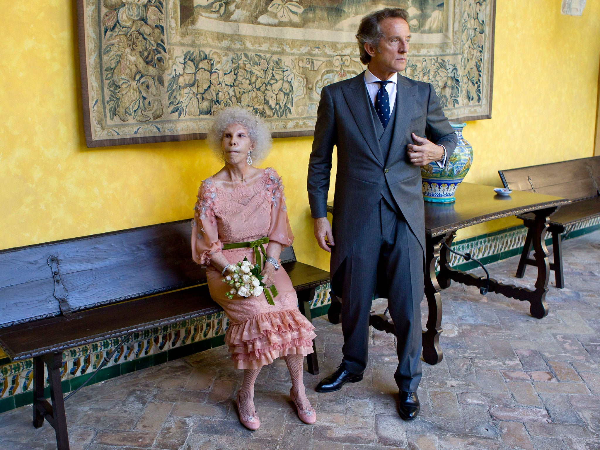 Spain's Duchess of Alba, Maria del Rosario Cayetana Fitz-James-Stuart and her husband Alfonso Diez pose after their wedding ceremony at the Palacio de las Duenas in Sevilla