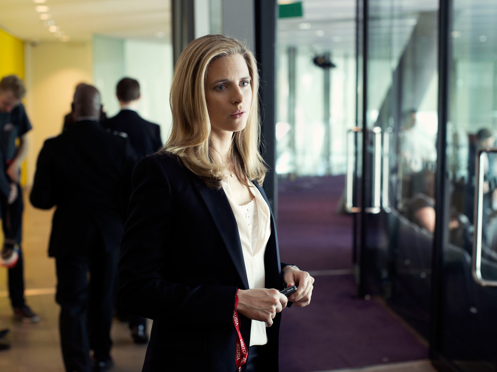 Brit Marling as PR woman Liz Garvey