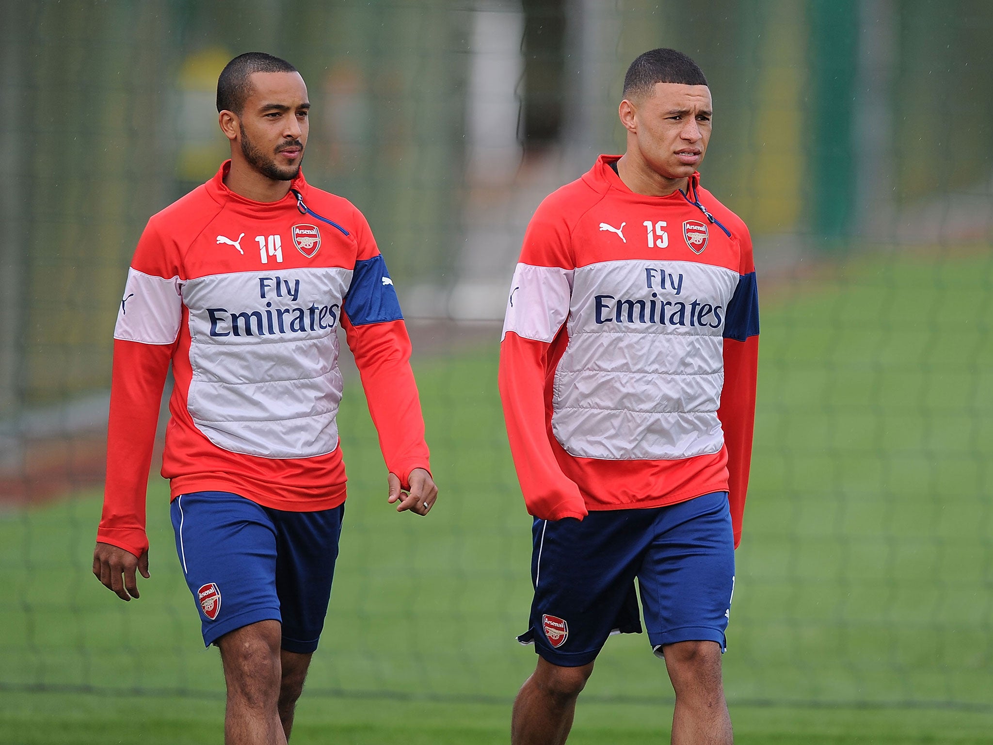 Theo Walcott (left) is a doubt for Arsenal