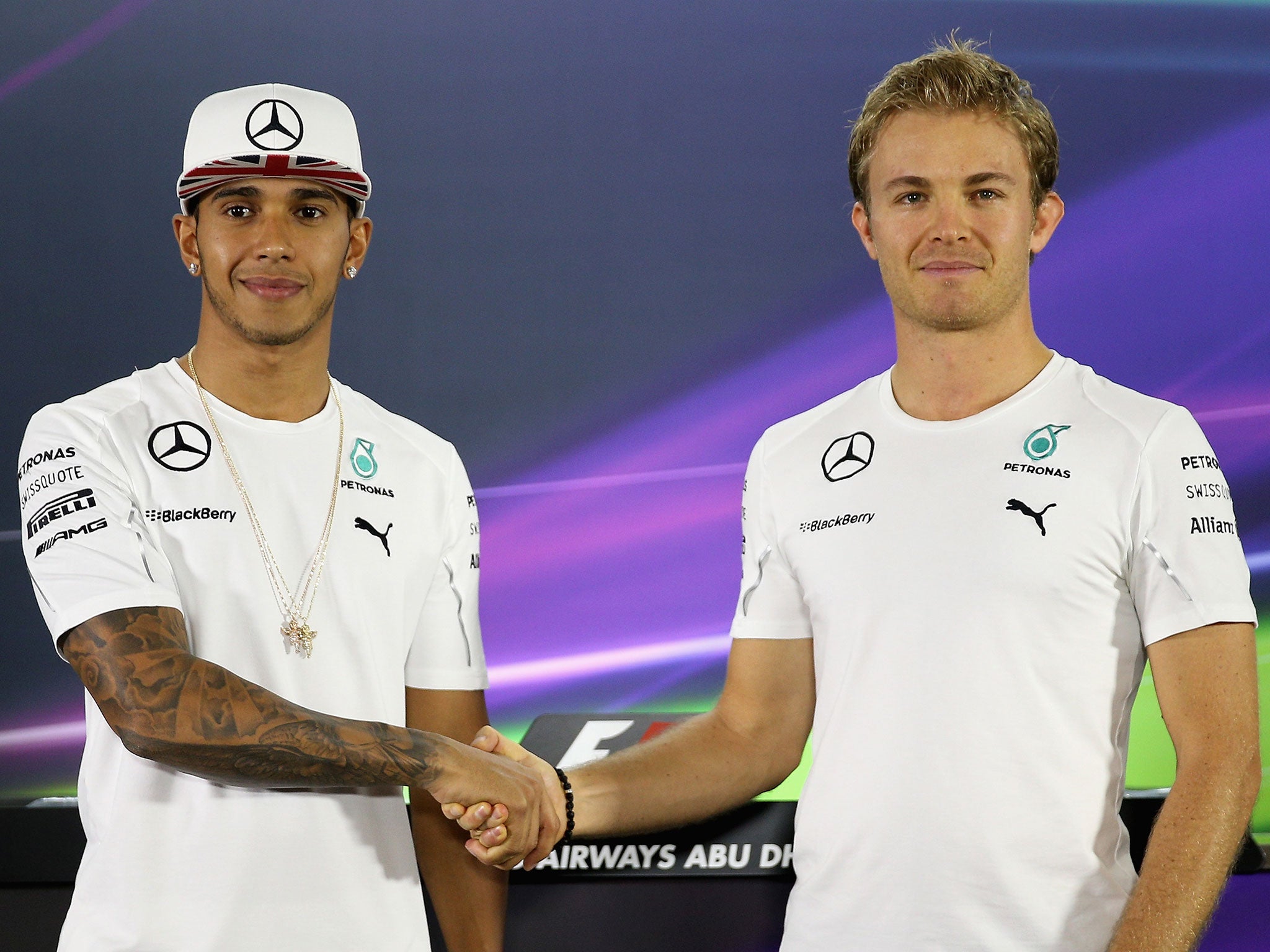 Lewis Hamilton and Nico Rosberg shake hands ahead of the Abu Dhabi Grand Prix