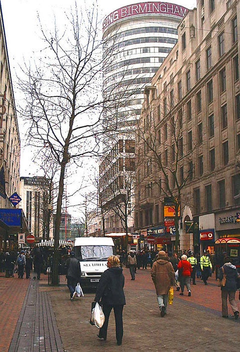 New Street in Birmingham with the Rotunda. On the right is the sign and doorway of "The Yard of Ale", the premises known as the "Tavern in the Town" pub