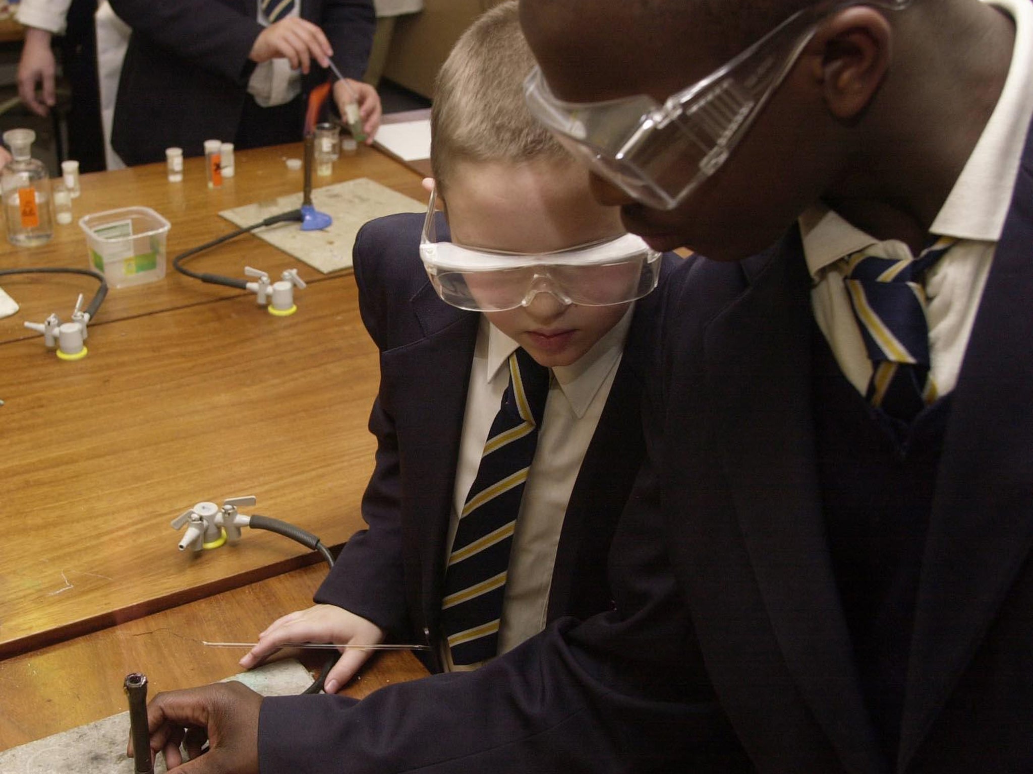 Pupils at Sir John Cass Red Coat C of E School in 2004. It is
the only state school to be threatened with closure, having
previously been judged ‘outstanding’ by Ofsted