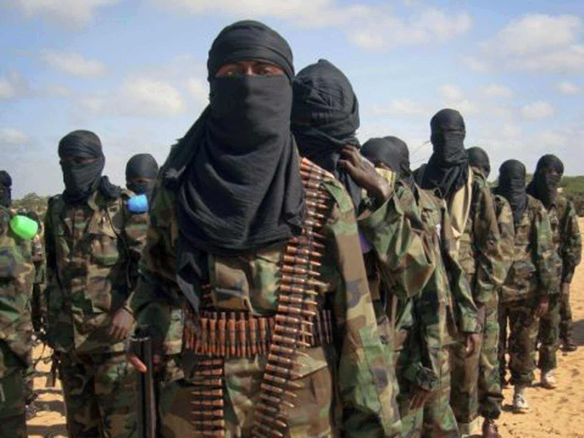 Armed members of the militant group al-Shabab attend a rally on the outskirts of Mogadishu, Somalia in 2012