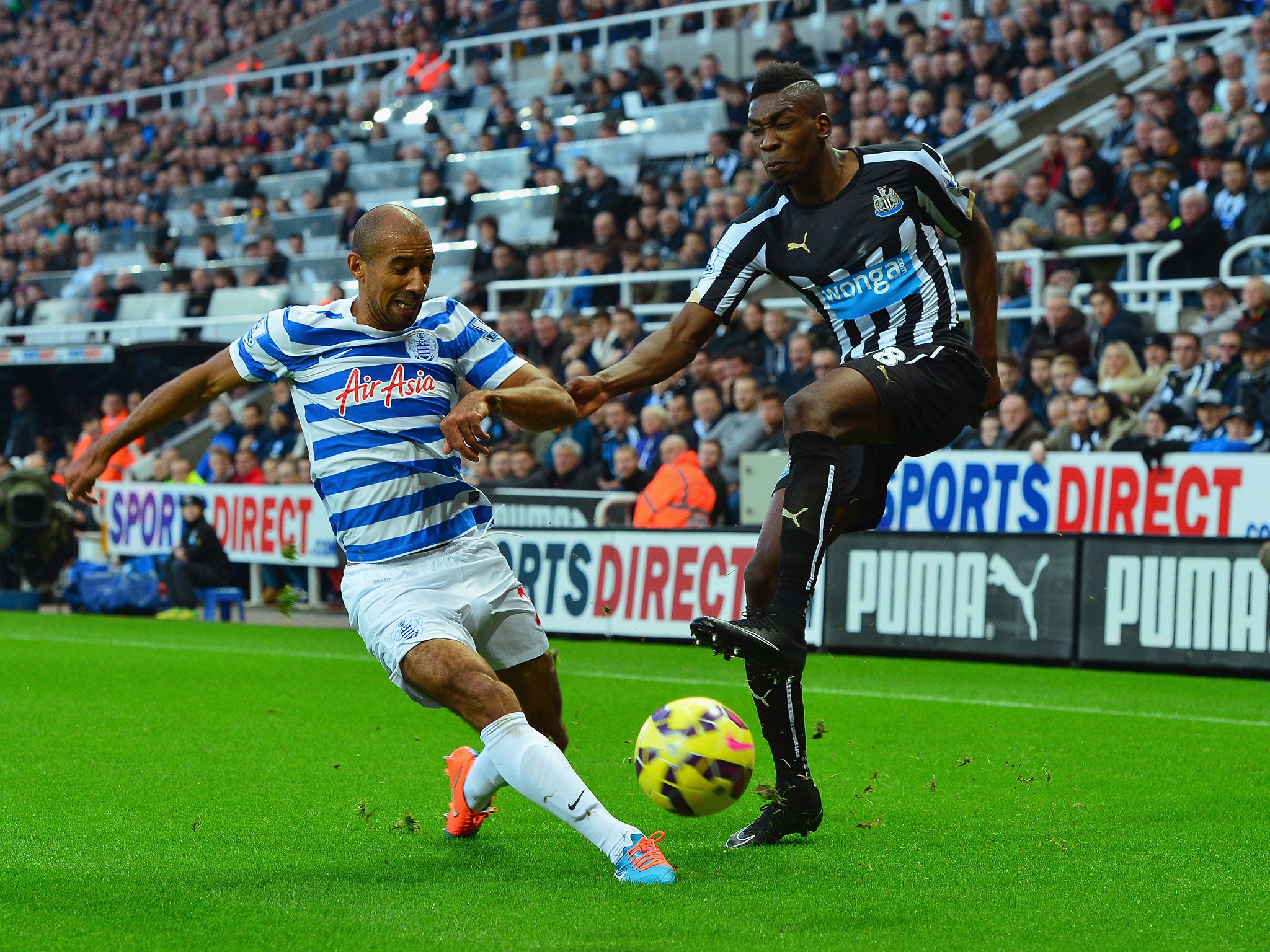 Karl Henry tackles Sammy Ameobi