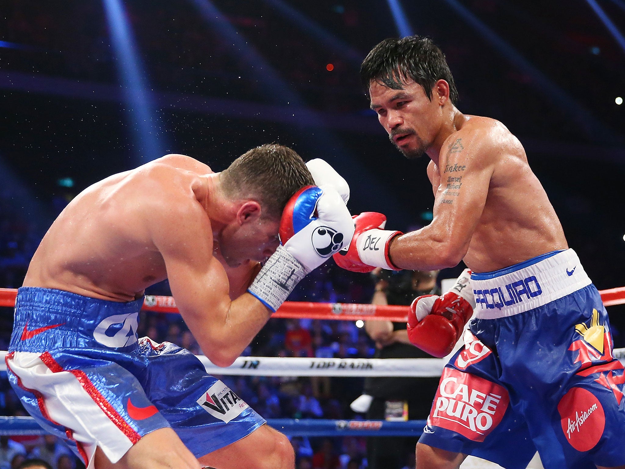 Manny Pacquiao lands a blow on Chris Algieri