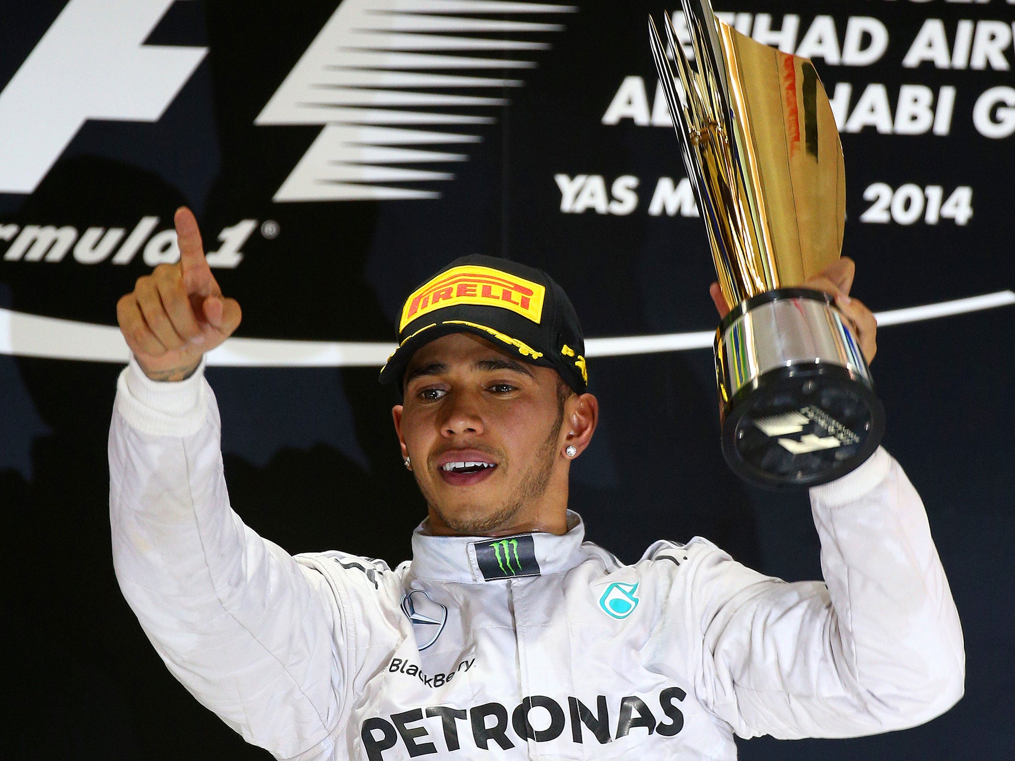 Lewis Hamilton celebrates on the podium