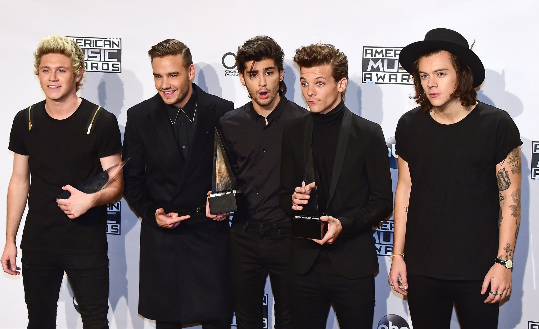 One Direction pose with their three awards at the AMAs 2014