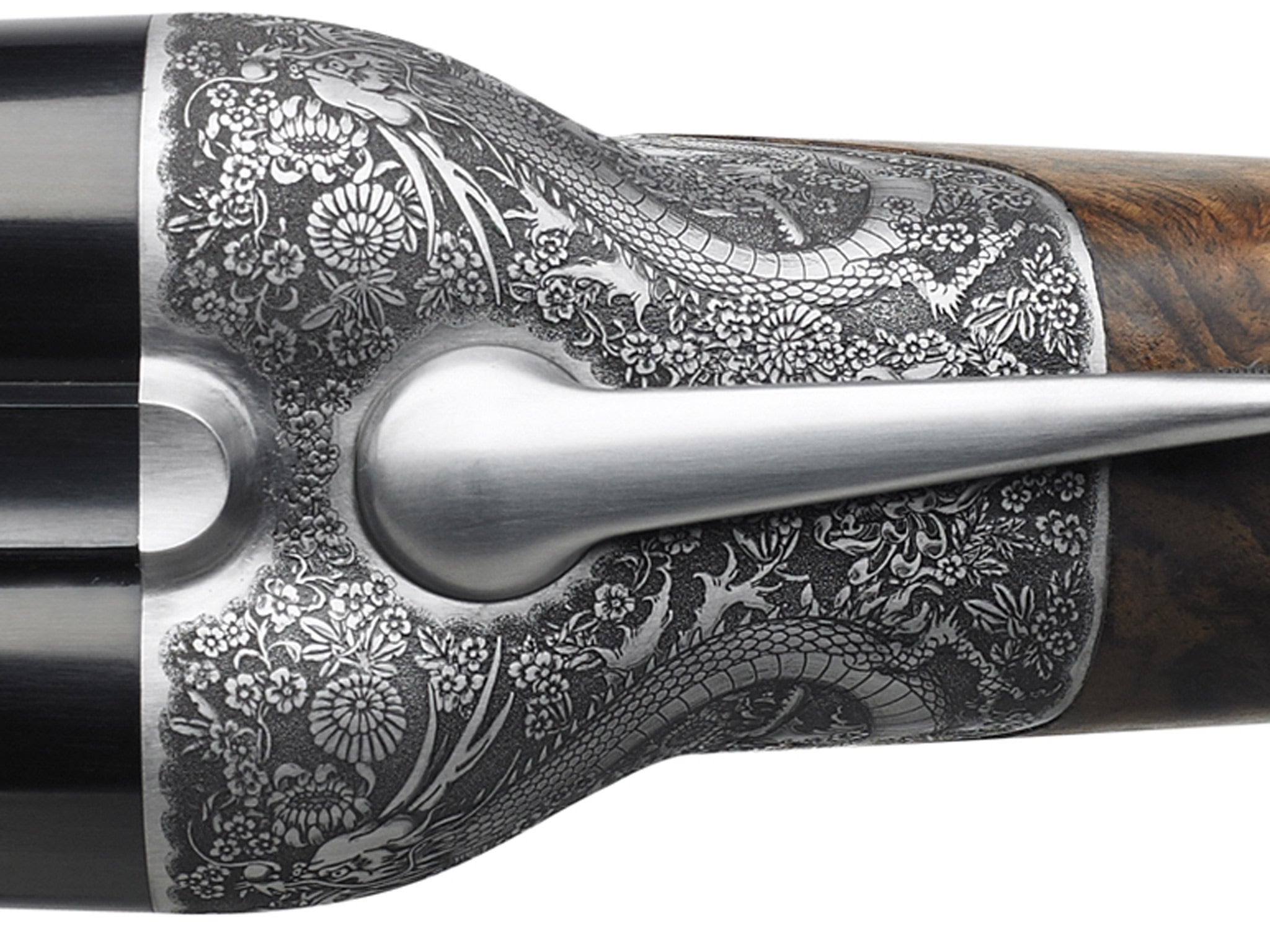 Newson created the fine engravings on the gun as well as a more ergonomic design. Source: Beretta