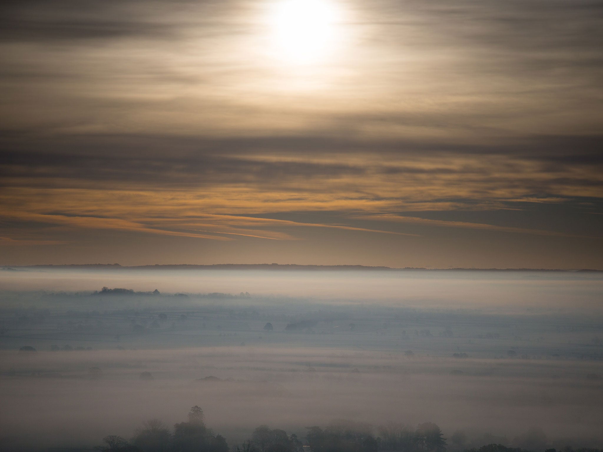 Mist and frost lingers in fields surrounding Glastonbury on 24 November, 2014